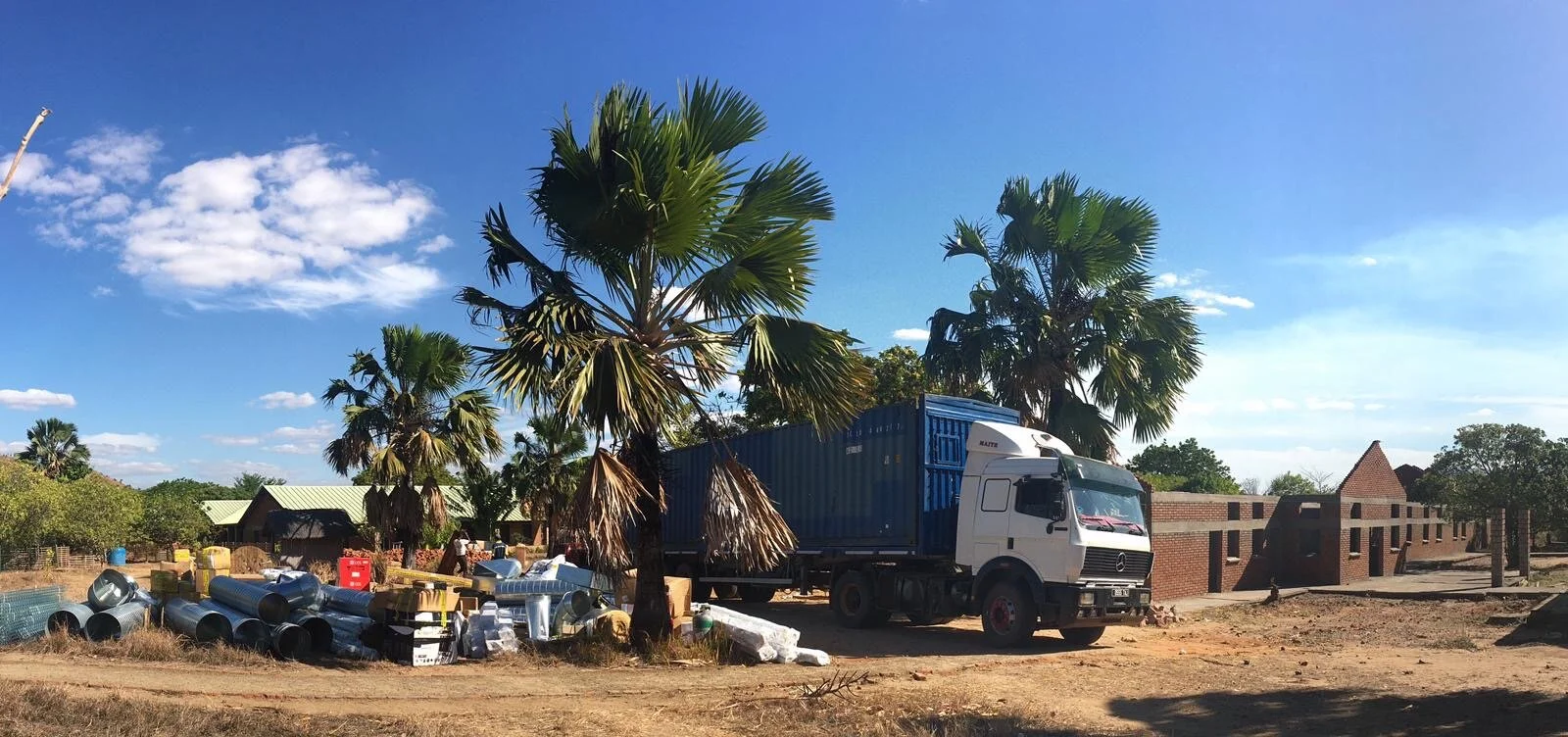 Unloading the container at the hospital – new operating building on the right
