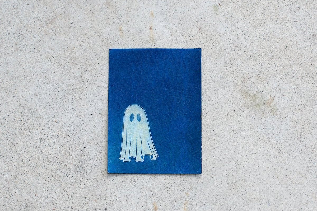 Blue and White Cyanotype handmade print of a cute ghost in motion. Handmade in Maine by photographer and artist Hannah McGowan.