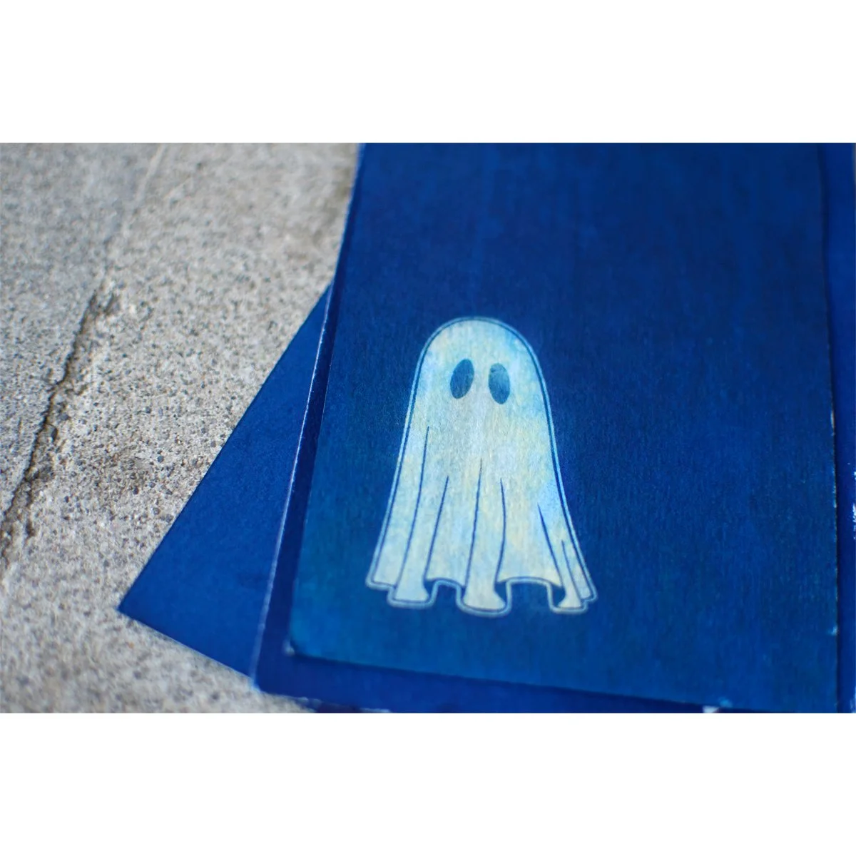 Blue and White Cyanotype handmade print of a cute ghost in motion. Handmade in Maine by photographer and artist Hannah McGowan.
