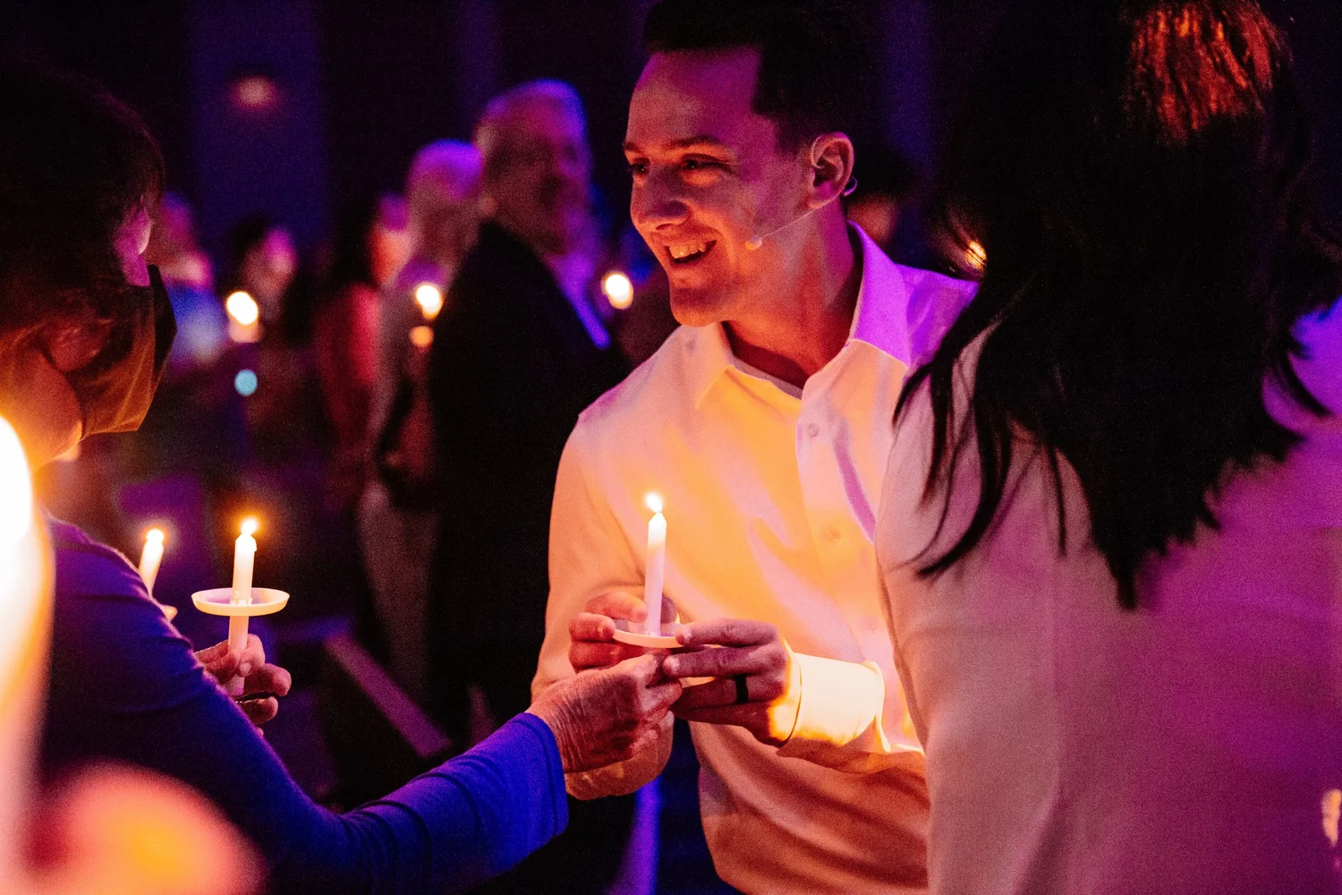 Sharing candlelight at a Northwood Christmas service