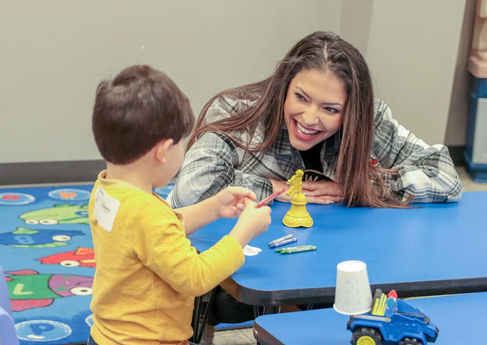A Northwood Kids leader connecting with a child
