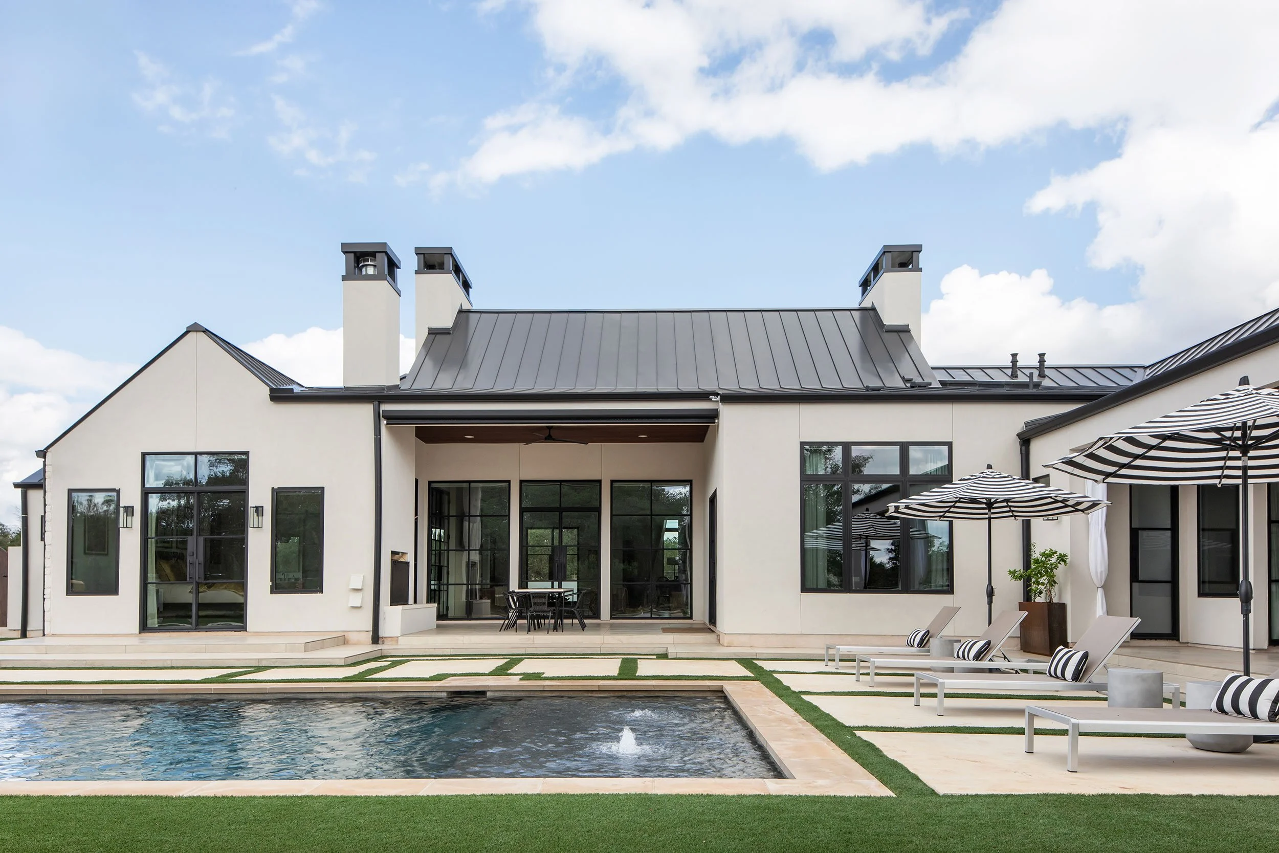 Back exterior from the Barton Creek New Construction project, designed by Urbane Design, Austin Texas, photography by Avery Nicole Photography