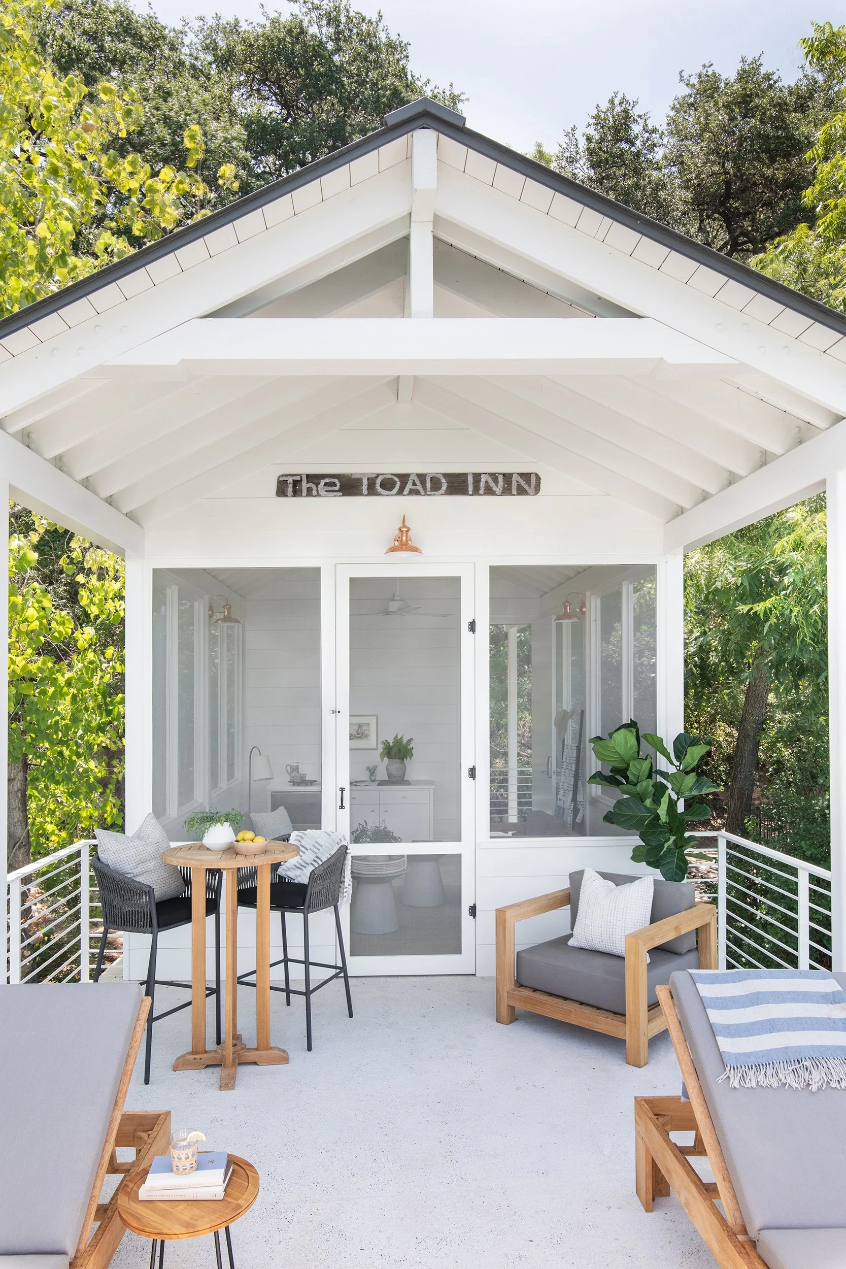 Exterior seating area from The Toad Inn boathouse, designed by The Pankonien Group, Lake Austin, Austin Texas, photography by Avery Nicole Photography