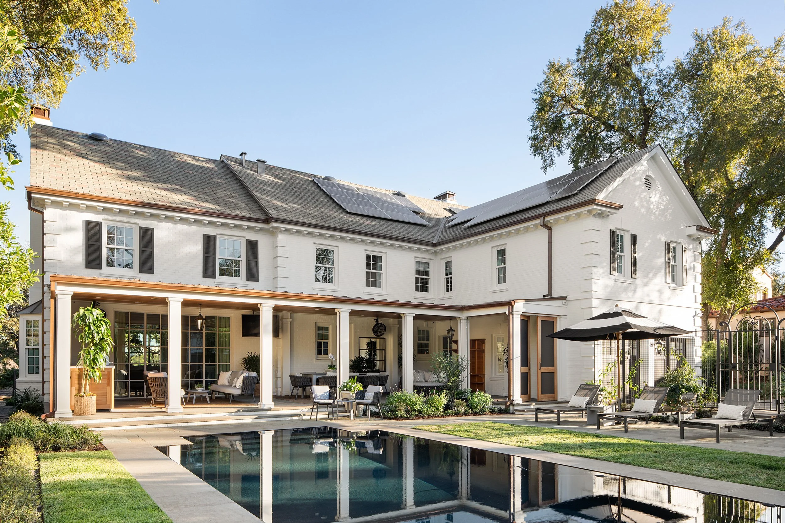 Old Enfield Estate back exterior by Grasso Gay Architects and built by Messer Design + Construction, residential photography by Avery Nicole Photography and located in Old Enfield Neighborhood in Austin, Texas