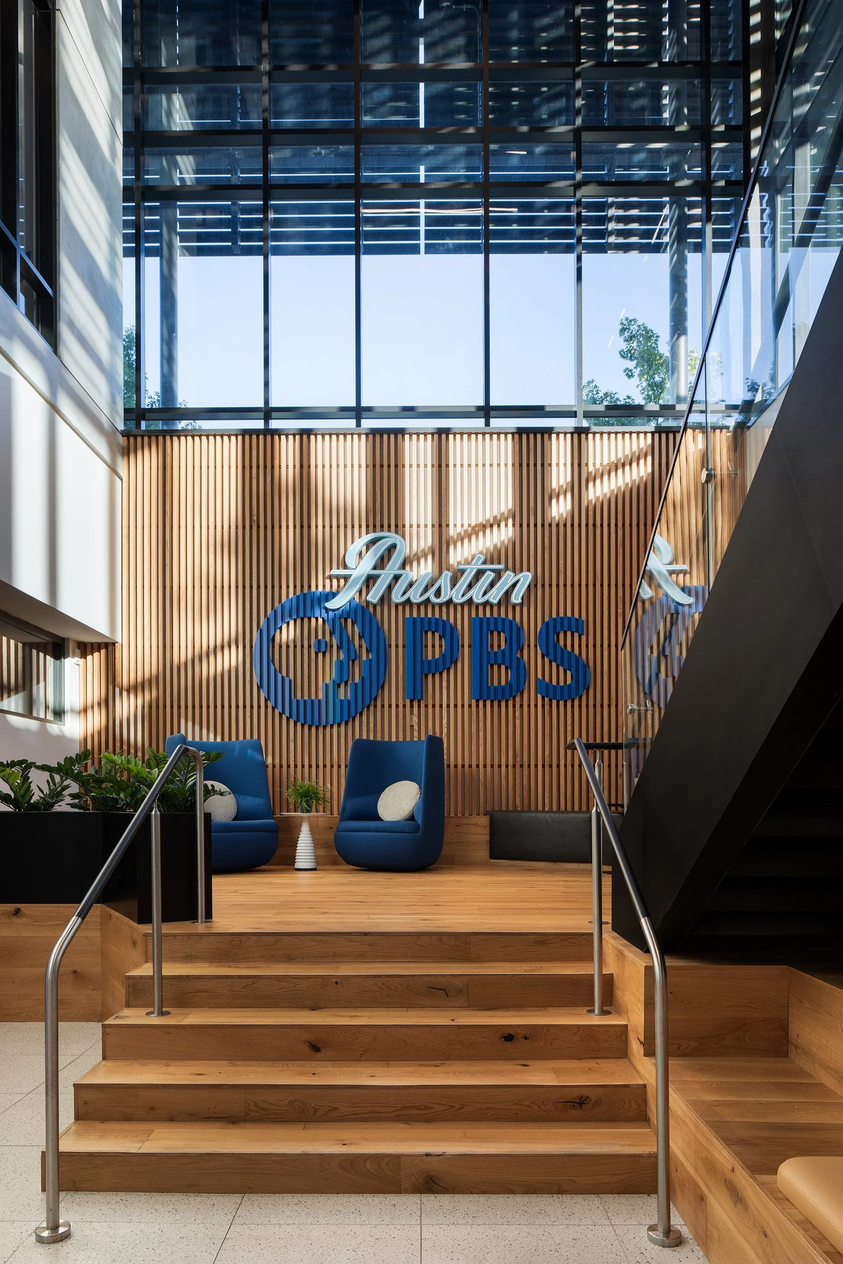 Austin PBS and ACL Live Headquarters lobby design by Britt Design Group, commercial interior design photography by Avery Nicole Photography and located in Austin, Texas