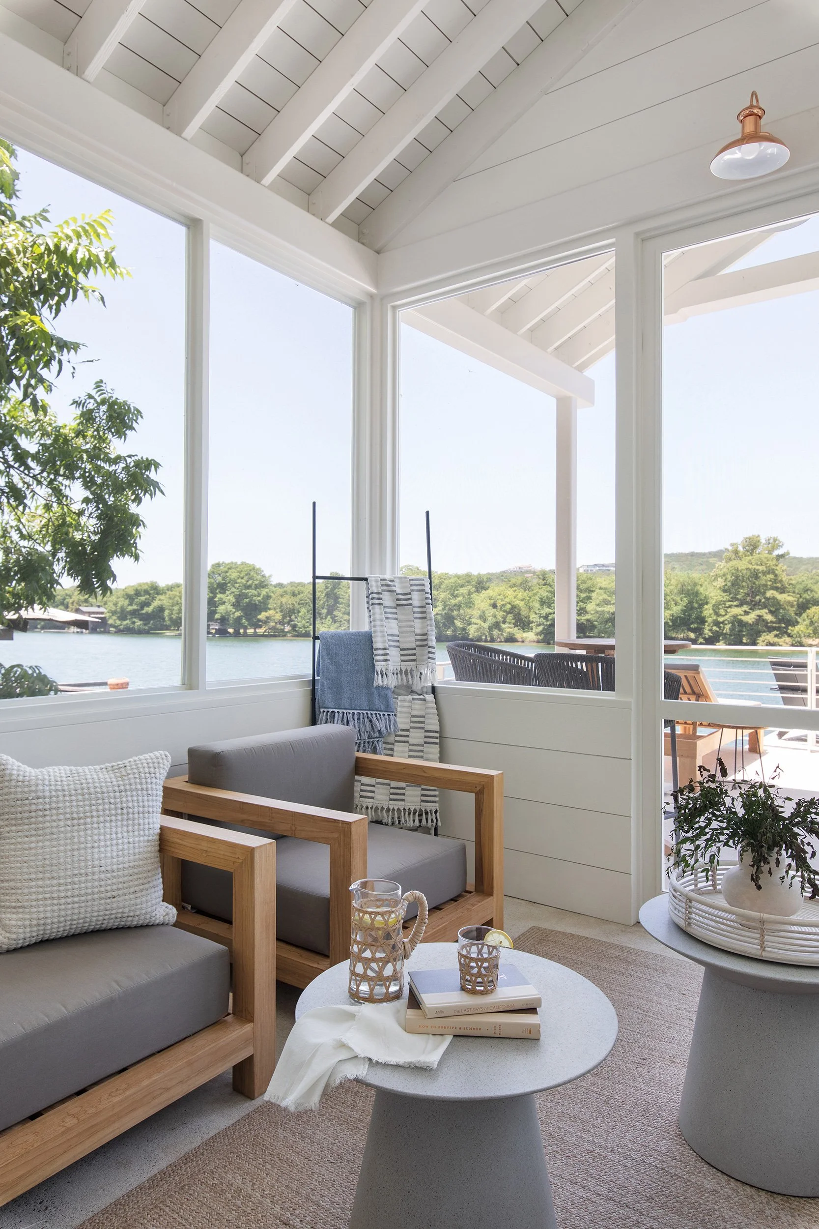 Seating area from The Toad Inn boathouse, designed by The Pankonien Group, Lake Austin, Austin Texas, photography by Avery Nicole Photography