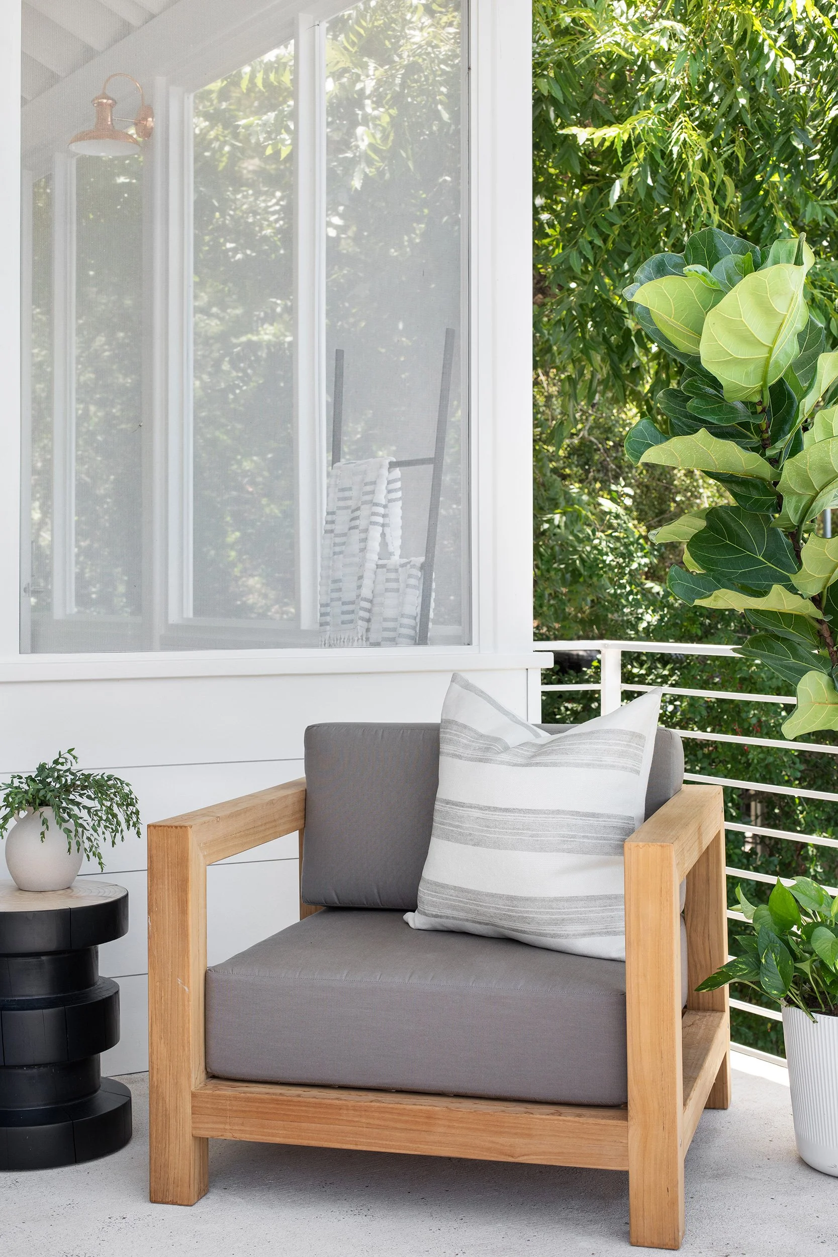 Exterior seating area vignette from The Toad Inn boathouse, designed by The Pankonien Group, Lake Austin, Austin Texas, photography by Avery Nicole Photography