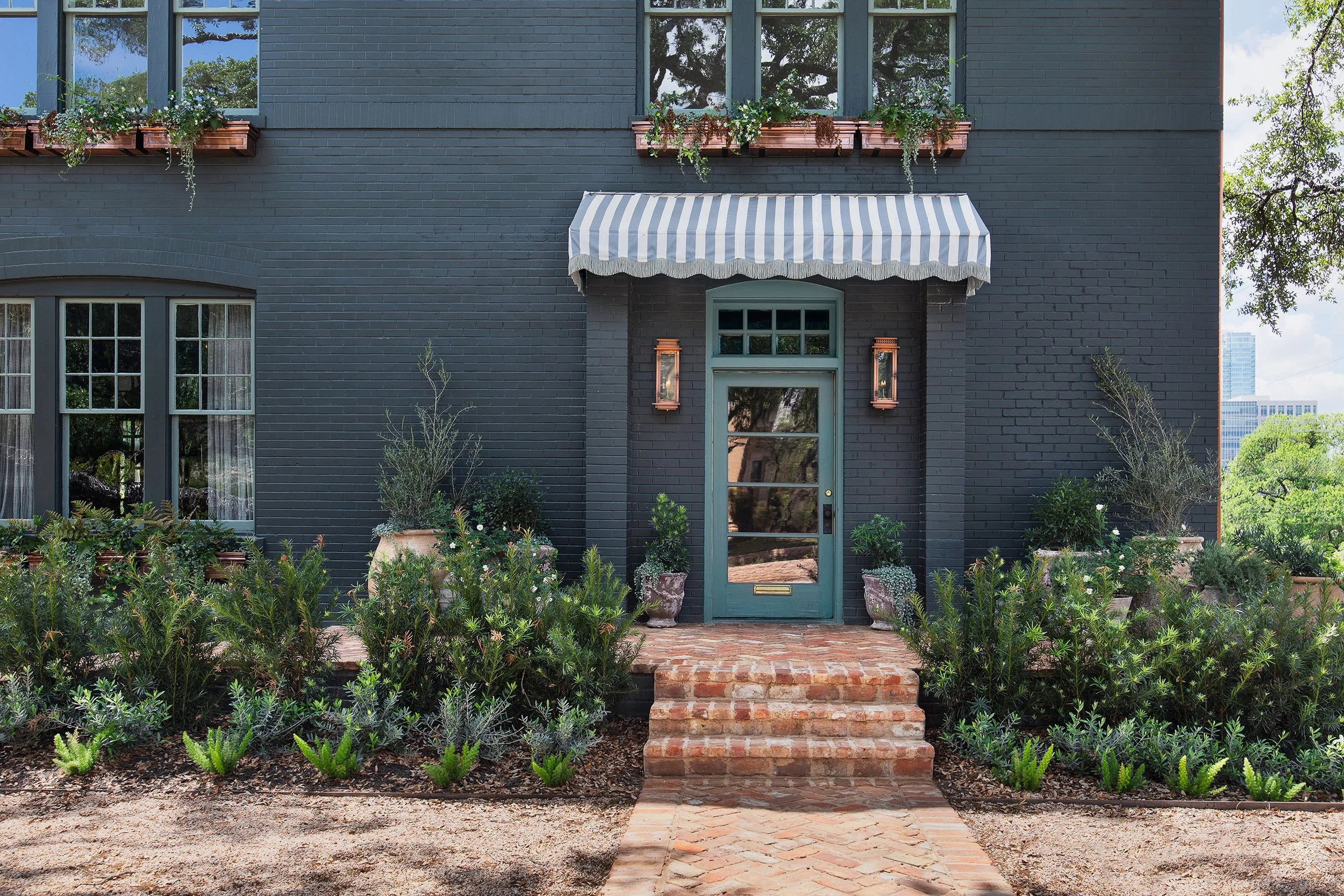 Front exterior from the West House project, designed by Chelsea Kloss with LV Collective, Austin Texas, photography by Avery Nicole Photography