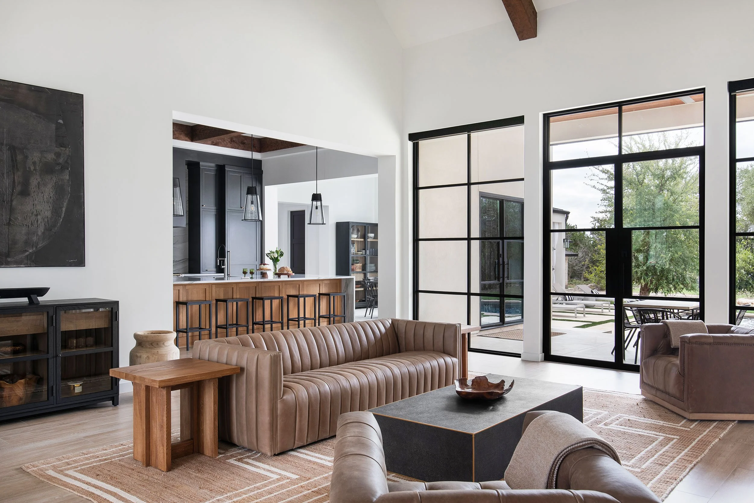 Living room and kitchen from the Barton Creek New Construction project, designed by Urbane Design, Austin Texas, photography by Avery Nicole Photography