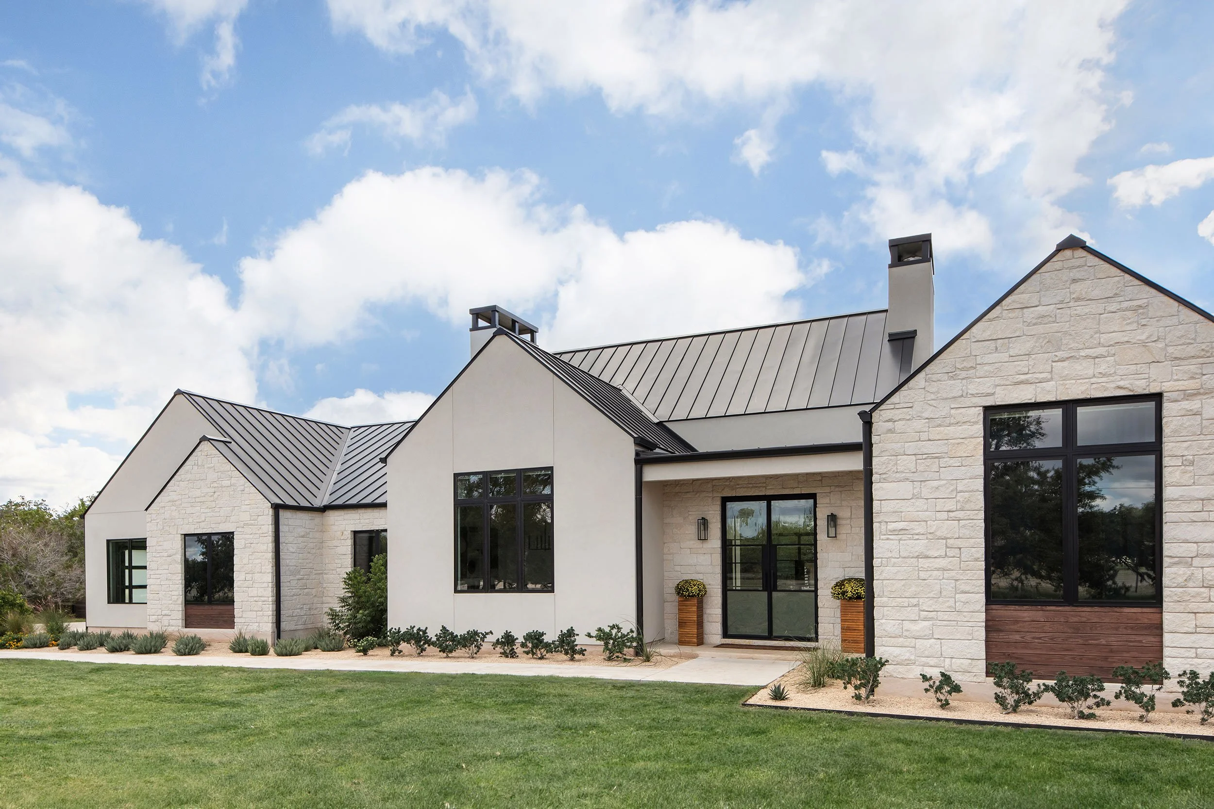 Front exterior from the Barton Creek New Construction project, designed by Urbane Design, Austin Texas, photography by Avery Nicole Photography