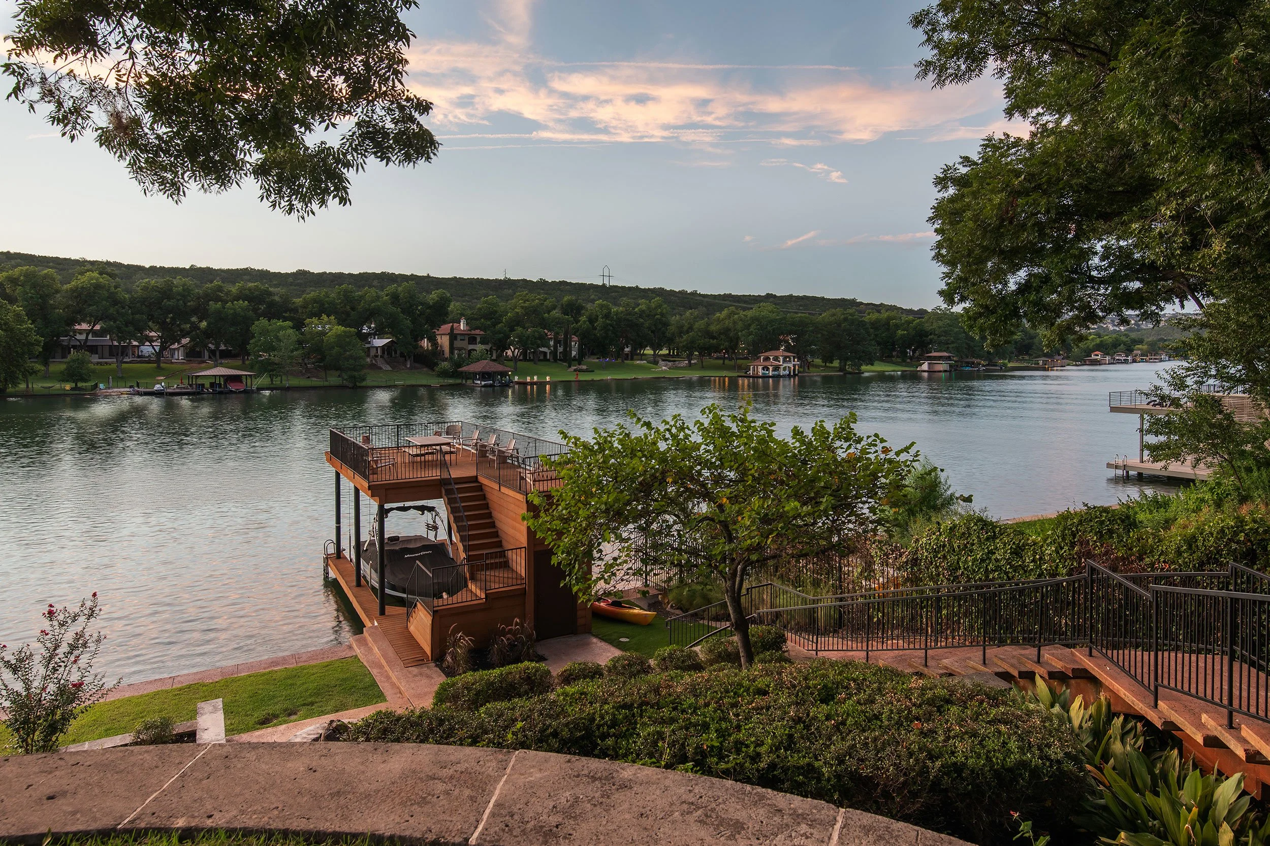 Back exterior lakeside from the Bruton Springs project, designed by HouseMill Design, Austin Texas, photography by Avery Nicole Photography