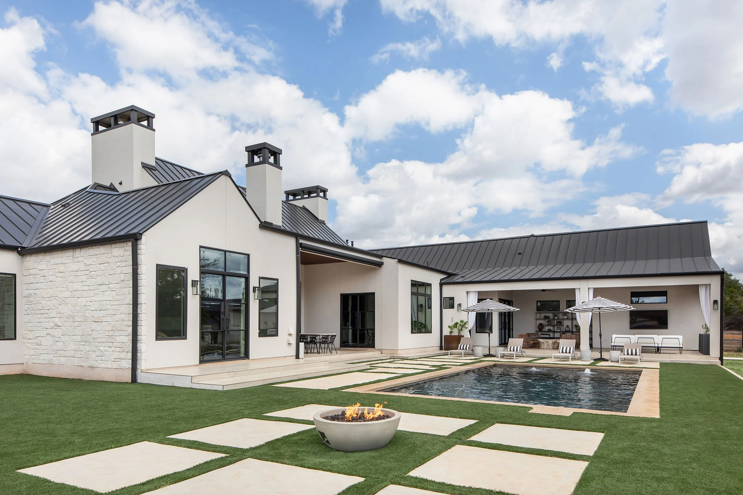 Back exterior from the Barton Creek New Construction project, designed by Urbane Design, Austin Texas, photography by Avery Nicole Photography