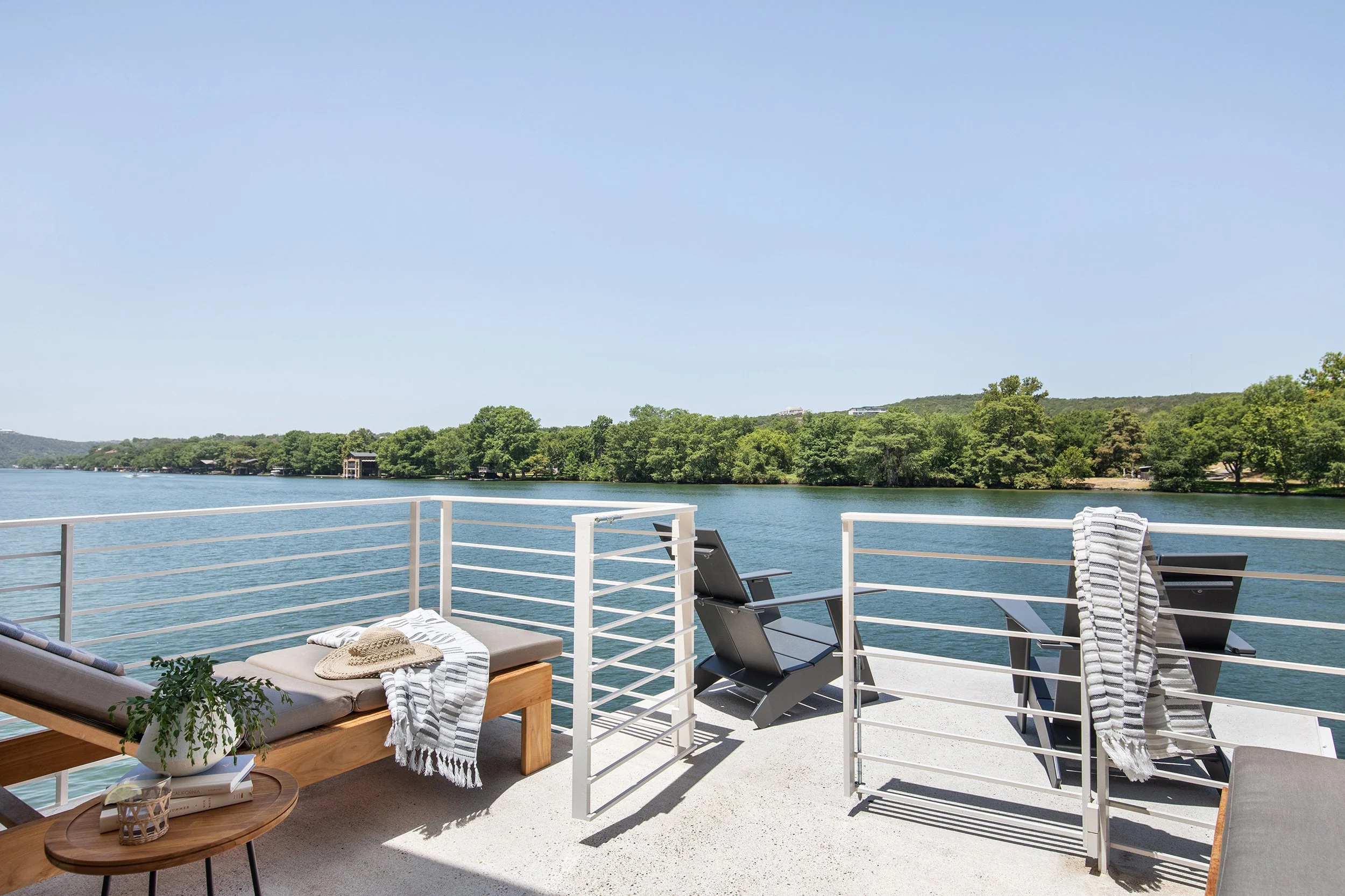 Lakeside seating area vignette from The Toad Inn boathouse, designed by The Pankonien Group, Lake Austin, Austin Texas, photography by Avery Nicole Photography