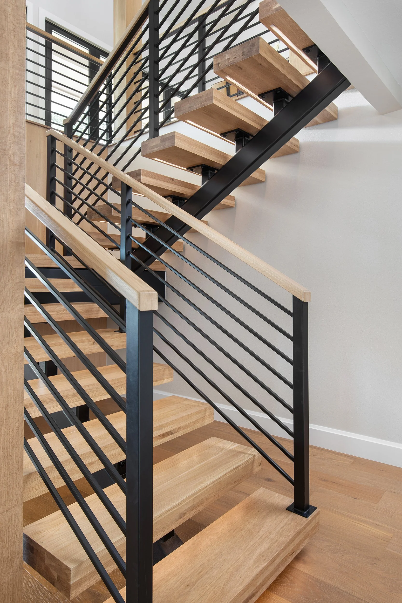 Valburn Remodel stairs design by Urbane Design and construction by Q Construction Solutions. Photography by Avery Nicole Photography and located in Austin, Texas