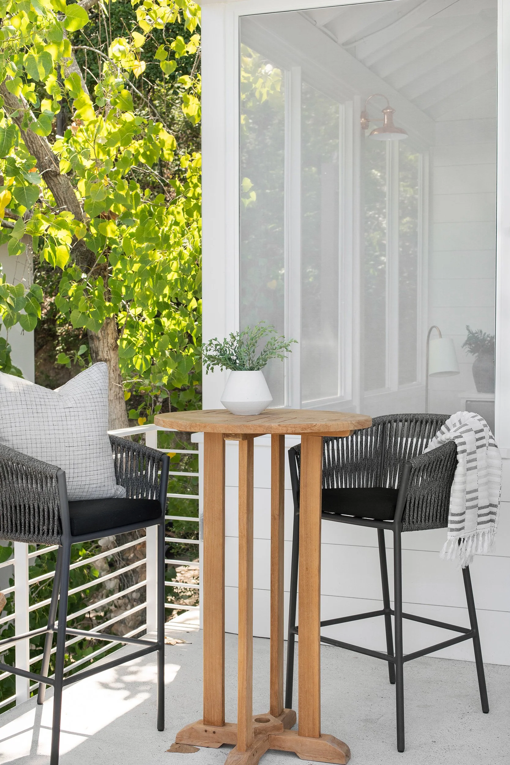 Exterior seating area vignette from The Toad Inn boathouse, designed by The Pankonien Group, Lake Austin, Austin Texas, photography by Avery Nicole Photography