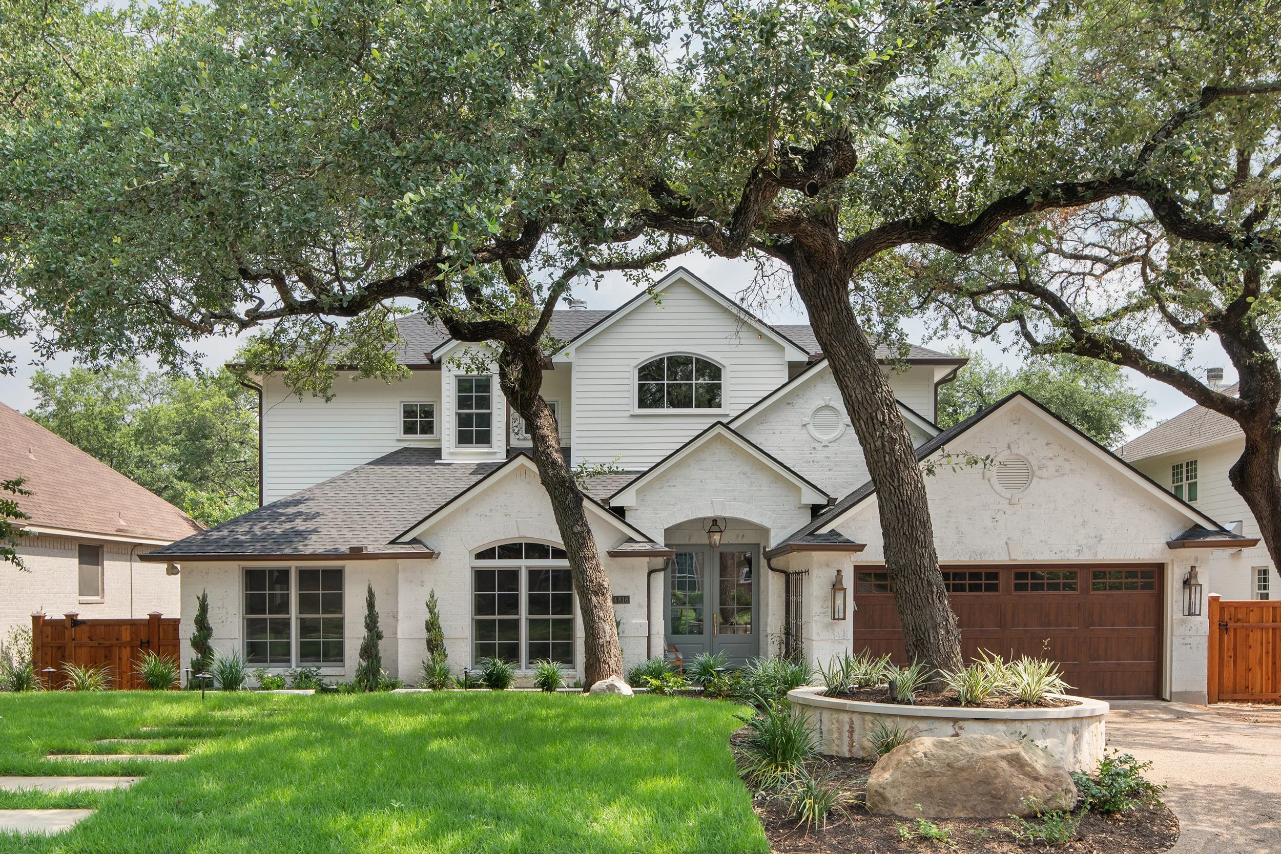 Travis Country Home front exterior design by Heather Scott Home & Design, build by Drake Build and architecture by Architecture by George. Photography by Avery Nicole Photography and located in Austin, Texas