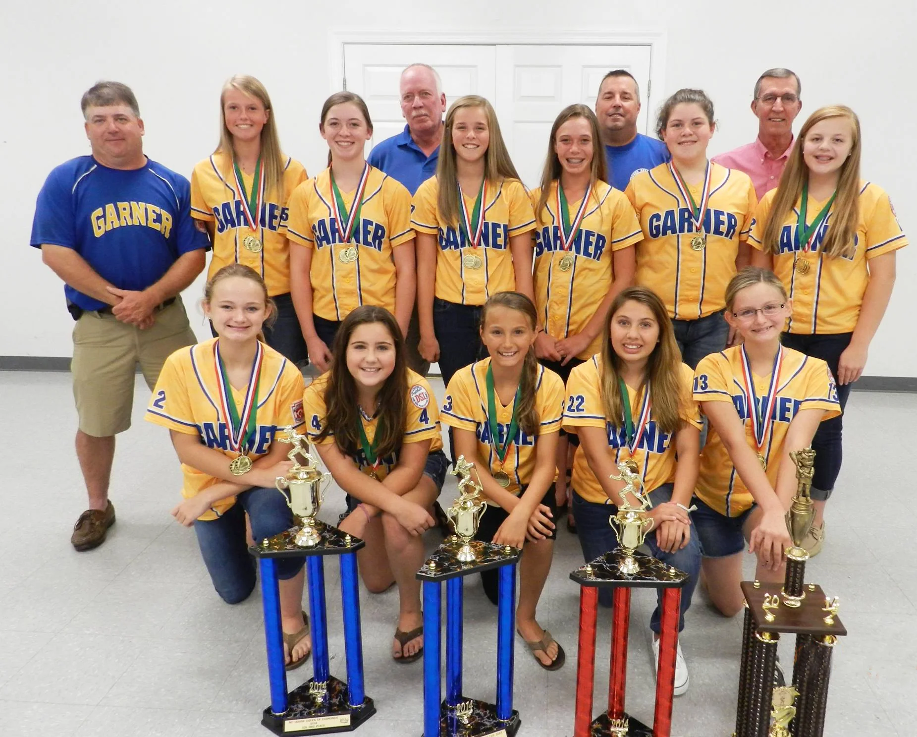 Garner Girls 12U All Stars, and Coaches attending a dinner hosted by the Garner Optimist Club, who helped sponsor them. They finished first in their District Tournament. They placed in the Regional, and won the Sportsmanship Award in their State Tournament.