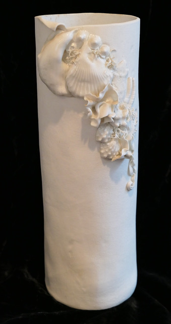 Clay vessel with porcelain ornamentation