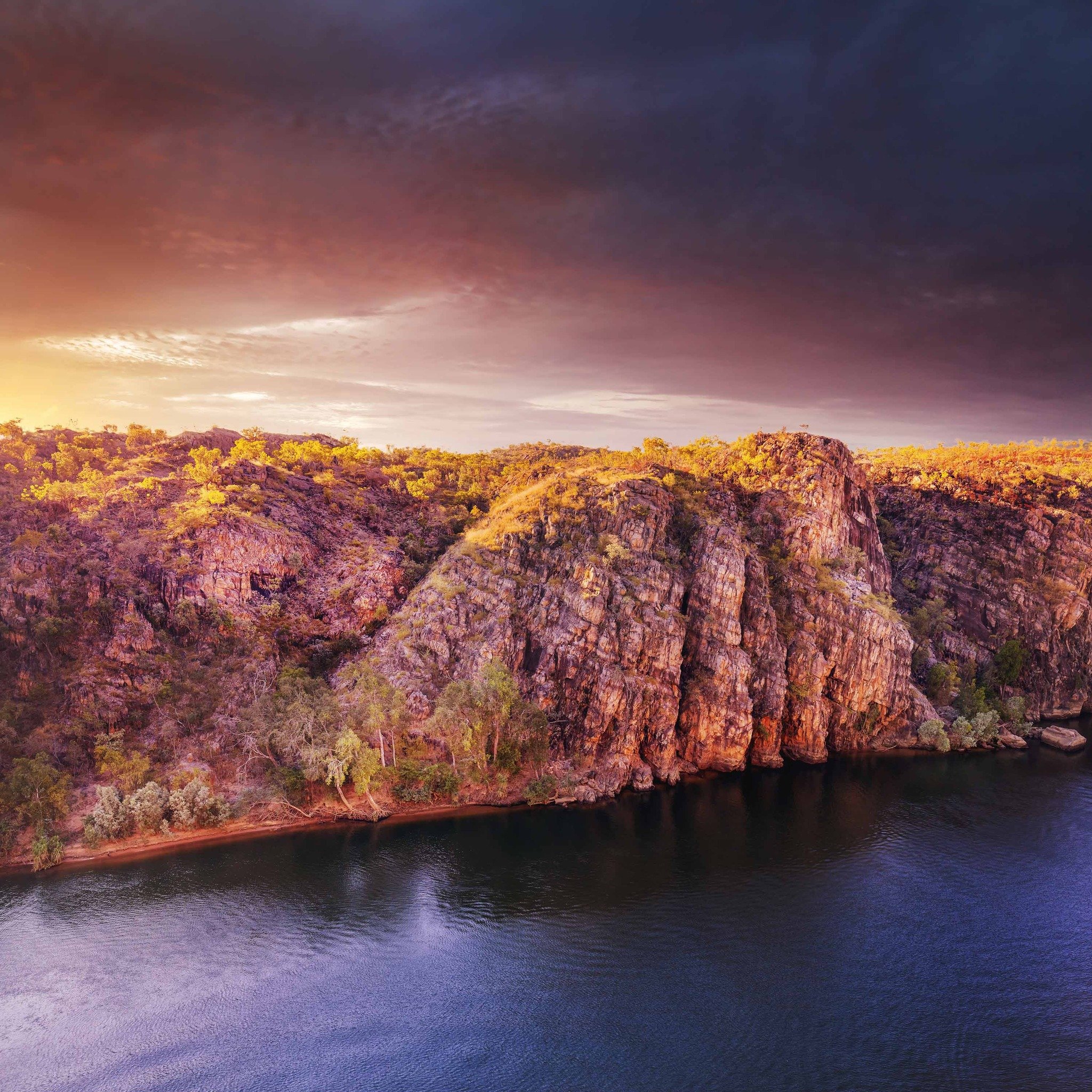 BARUWEI FIRE

The cliffs in this image mark the imposing entrance into the gorge system of Nitmiluk National Park. 

Shooting sunrise and sunset from the Baruwei Lookout above the first gorge is something I do almost every visit to Nitmiluk! Yet, it 