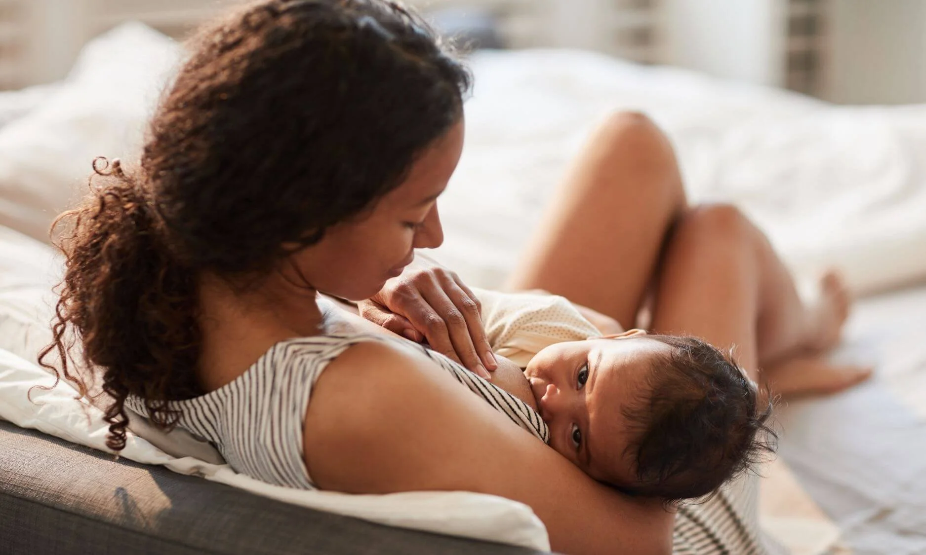 woman breastfeeding her baby