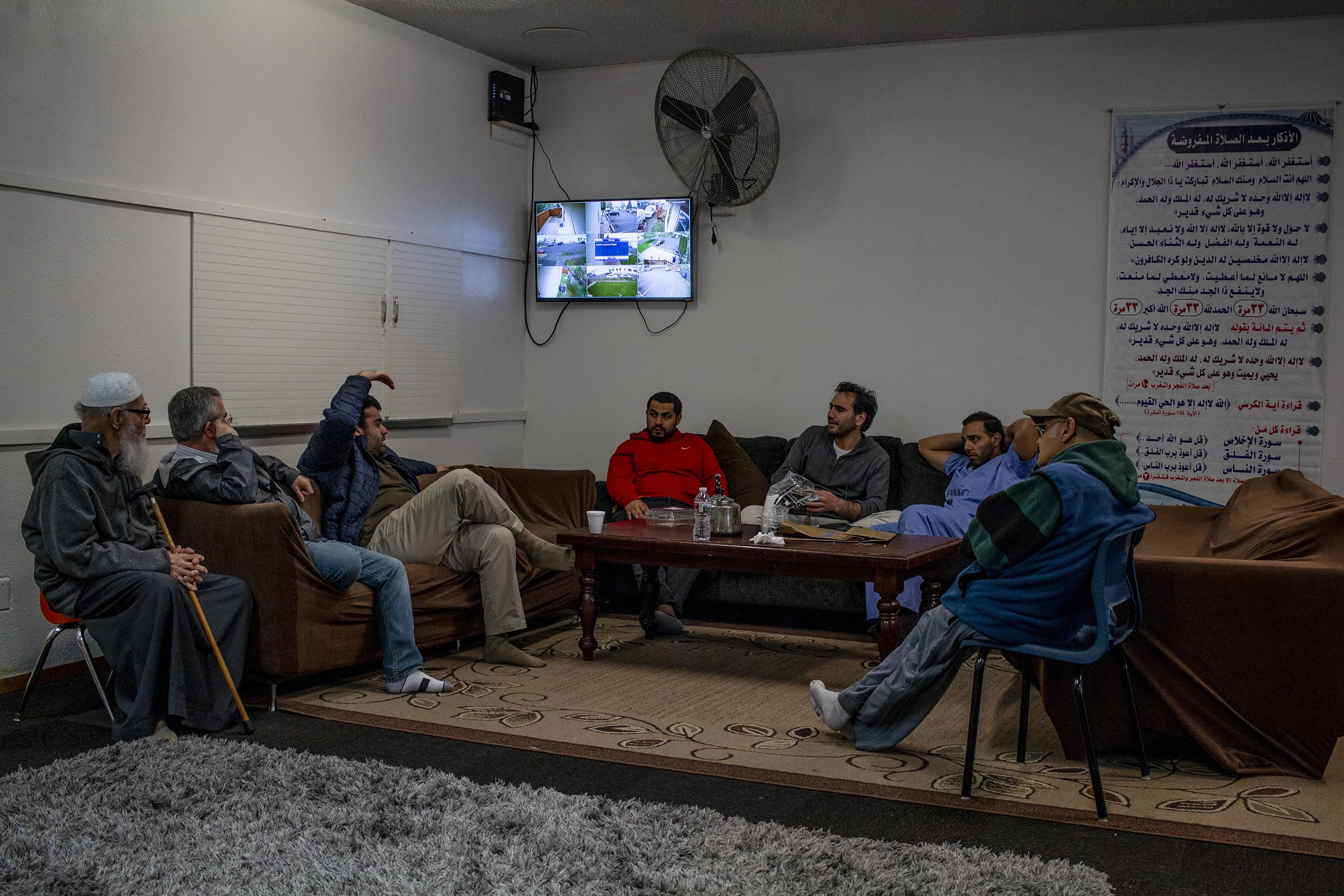  Worshipers at the Eugene Islamic Center talk after finishing the midday prayer. The Mosque is a place of worship and a general gathering place for the Muslim community of Eugene. 