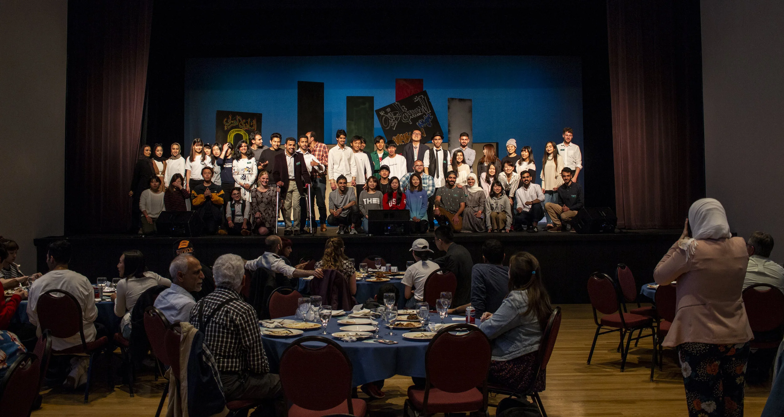  After Arabian Night concluded, everyone who helped run the event posed on stage for a final group-photo. Members of the Arab Student Union, Muslim Student Association and Saudi Student Association attended and assisted in hosting the event that nigh