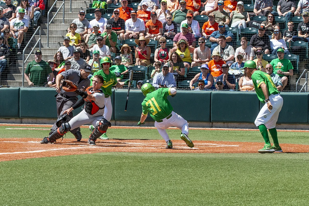  University of Oregon Ducks batter Tanner Smith (#31) tries to slide to home base before he can be tagged out by Oregon State University Beavers catcher Adley Rutschman (#35). The University of Oregon answered back to yesterday’s loss by defeating Or