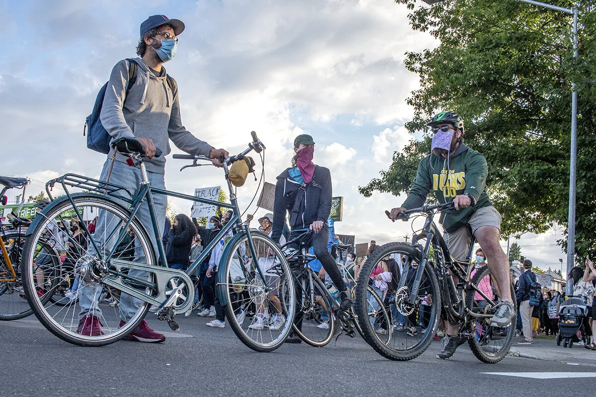  Bike riders acting as security and block roads as protestors march through the streets of Eugene. Hundreds of protestors marched from Monroe Park through the Whiteaker area of Eugene, Oregon, Thursday night June 11. The protest, organized by Black U