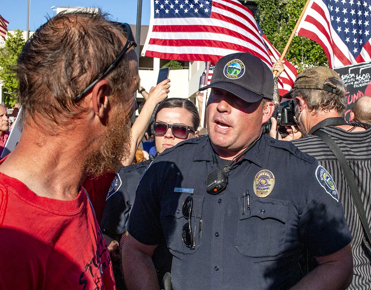  A Springfield police officer directing a man to step back after a fight came close to breaking out. A pro-police rally was held in Springfield, Oregon, Monday afternoon, June 22. The event, organized by Springfield resident Joe Fritz, was intended t