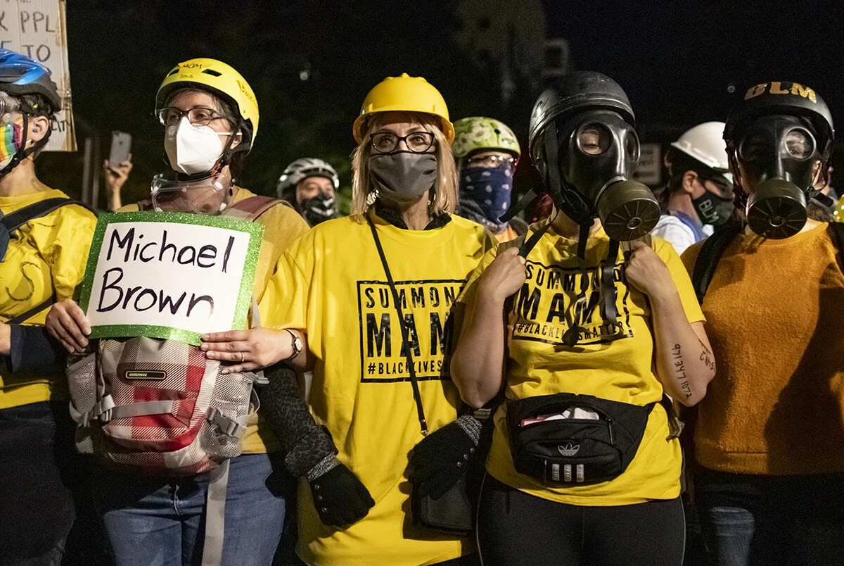  Protesting moms lining up in front of the federal courthouse. More than 3000 people showed up Friday, July 24, for the 58th consecutive night of protests at the federal courthouse and Multnomah County Justice Center in Portland, Oregon. The night st