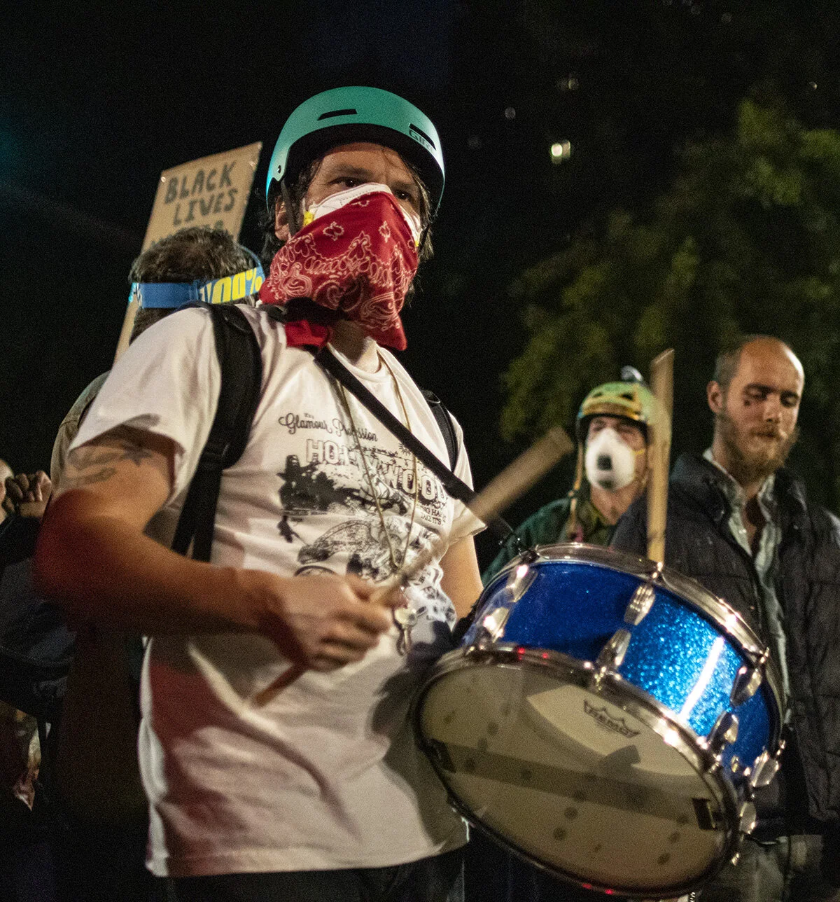  A protester beating their drum in front of the federal courthouse. More than 3000 people showed up Friday, July 24, for the 58th consecutive night of protests at the federal courthouse and Multnomah County Justice Center in Portland, Oregon. The nig