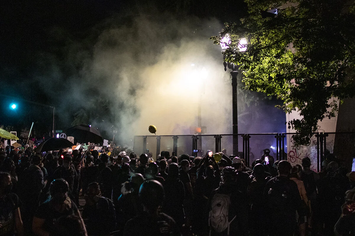  A cloud of tear gas drifting toward protesters. Approximately 3000 protesters gathered outside the Multnomah County Justice Center and the U.S. District Courthouse in downtown Portland, Oregon, on Saturday night, July 25, marking 59 consecutive days