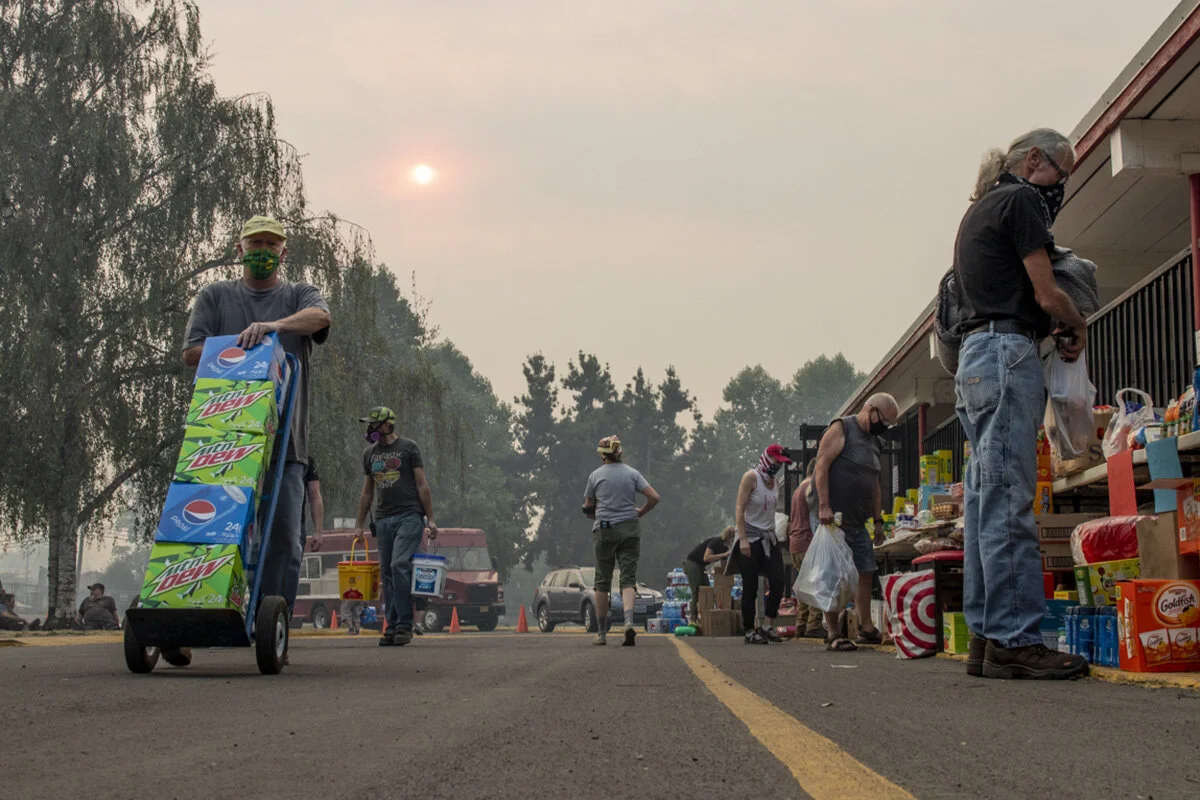  Volunteers organizing food and supplies at Thurston High School after the Holiday Farm fire forced residents to evacuate their homes. 