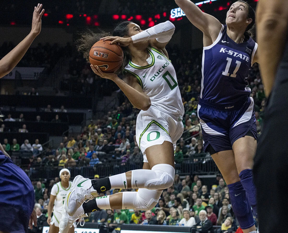  University of Oregon Ducks Satou Sabally (#0) jumps in an attempt to shoot past Kansas State Wildcats Peyton Williams (#11). The University of Oregon Ducks women’s basketball team defeated the Kansas State Wildcats 89 – 51 in Matthew Knight Arena Sa