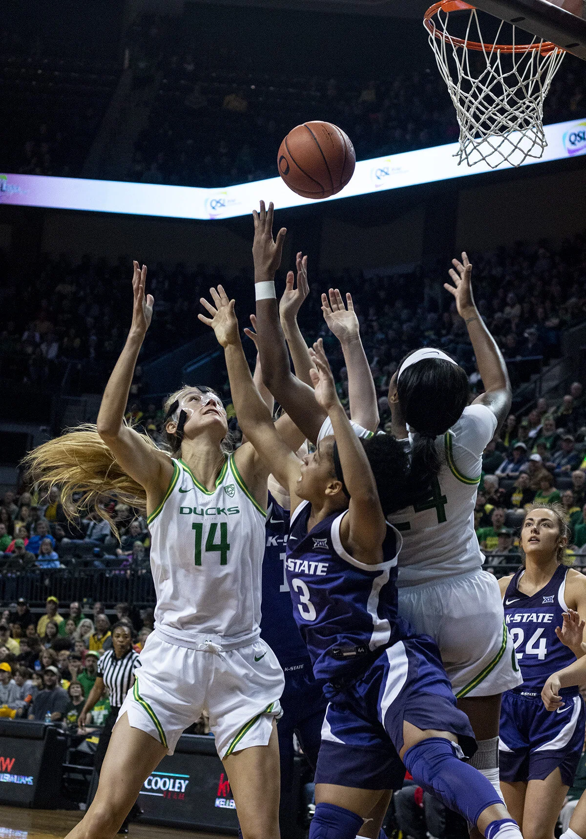  University of Oregon Ducks Lydia Giomi (#14) and Kansas State Wildcats Angela Harris (#3) look for a rebound. The University of Oregon Ducks women’s basketball team defeated the Kansas State Wildcats 89 – 51 in Matthew Knight Arena Saturday. Sabrina