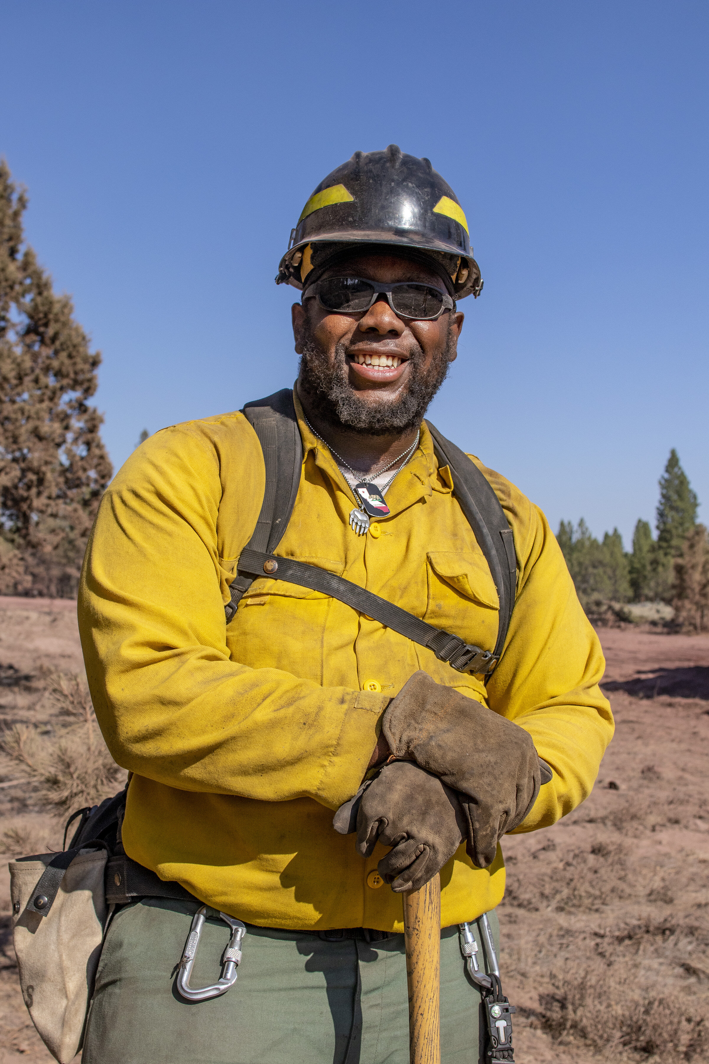  Wildland firefighter Gamari Griffin posing for a portrait during mop up operations at the Bootleg Fire in southern Oregon. 