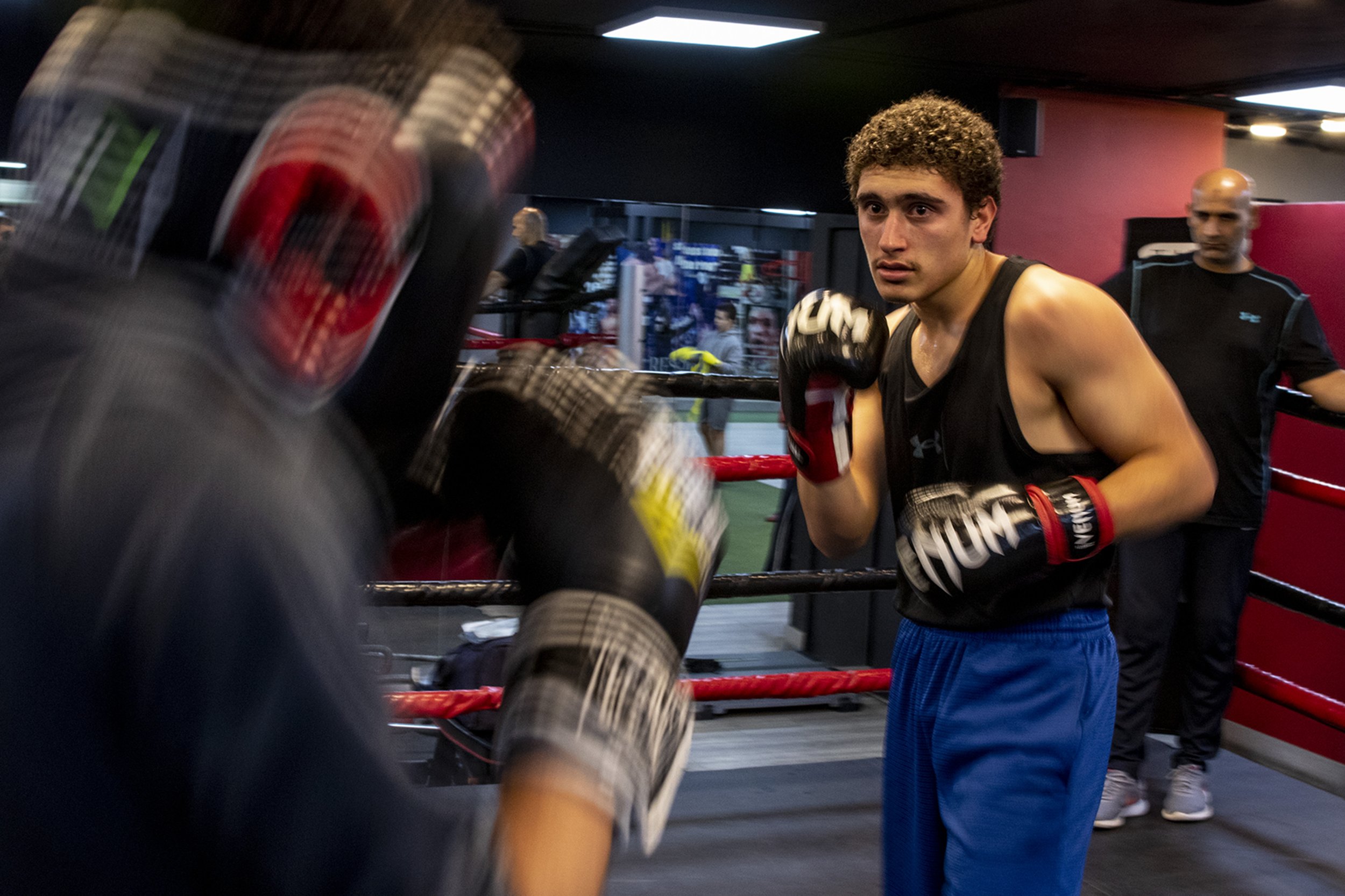  Sixteen-year-old Mesmar taking a low-guard stance (one hand covering the chin with the other covering the ribs) during a sparring round with al-Qaissi. 