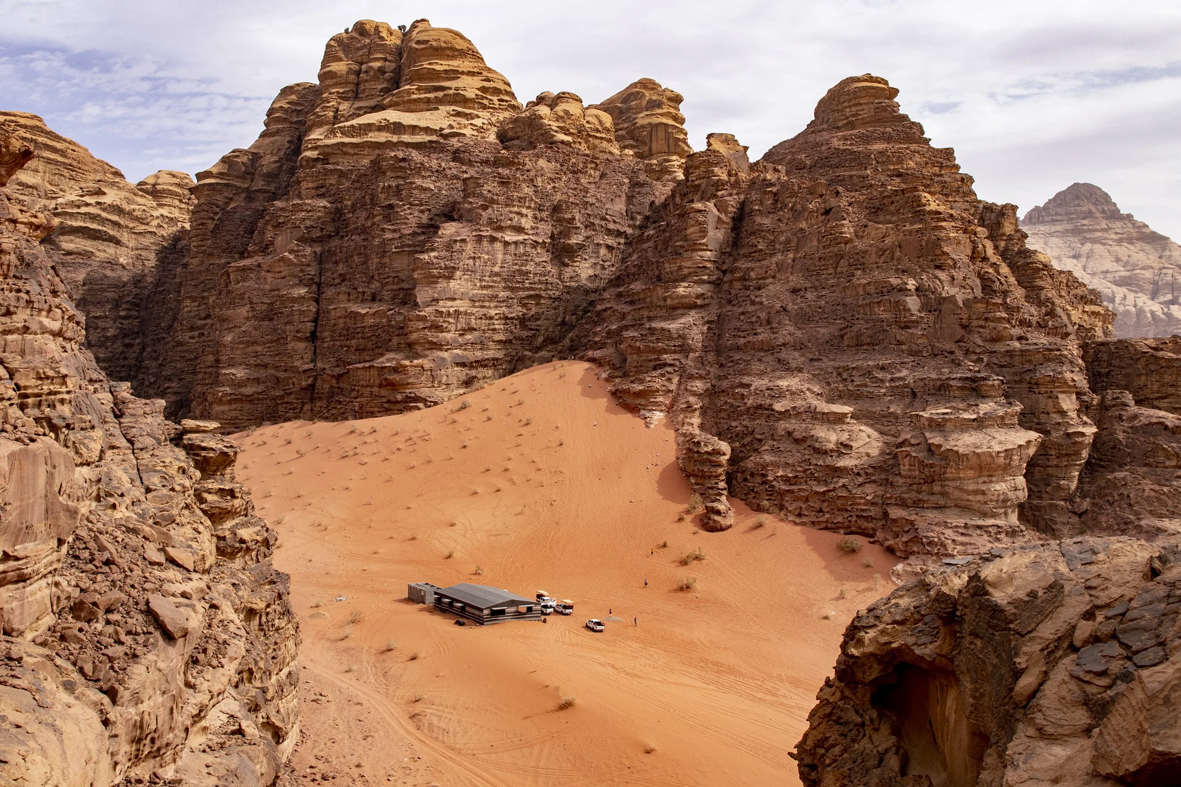  A camping site located between mountains in Wadi Rum. Wadi Rum's otherworldly beauty and scenery have routinely led it to be the filming location of major Hollywood films. This includes films such as "Star Wars," "The Martian," "Lawrence of Arabia" 