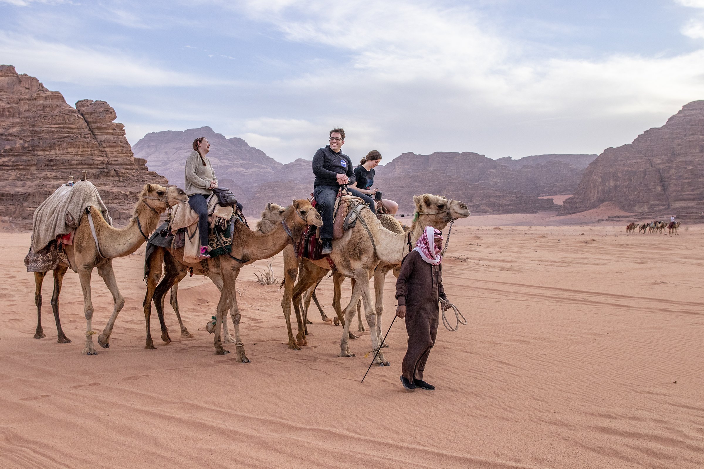  Bedouin tribesman Nayef leading a group on a camel ride through Wadi Rum. 
