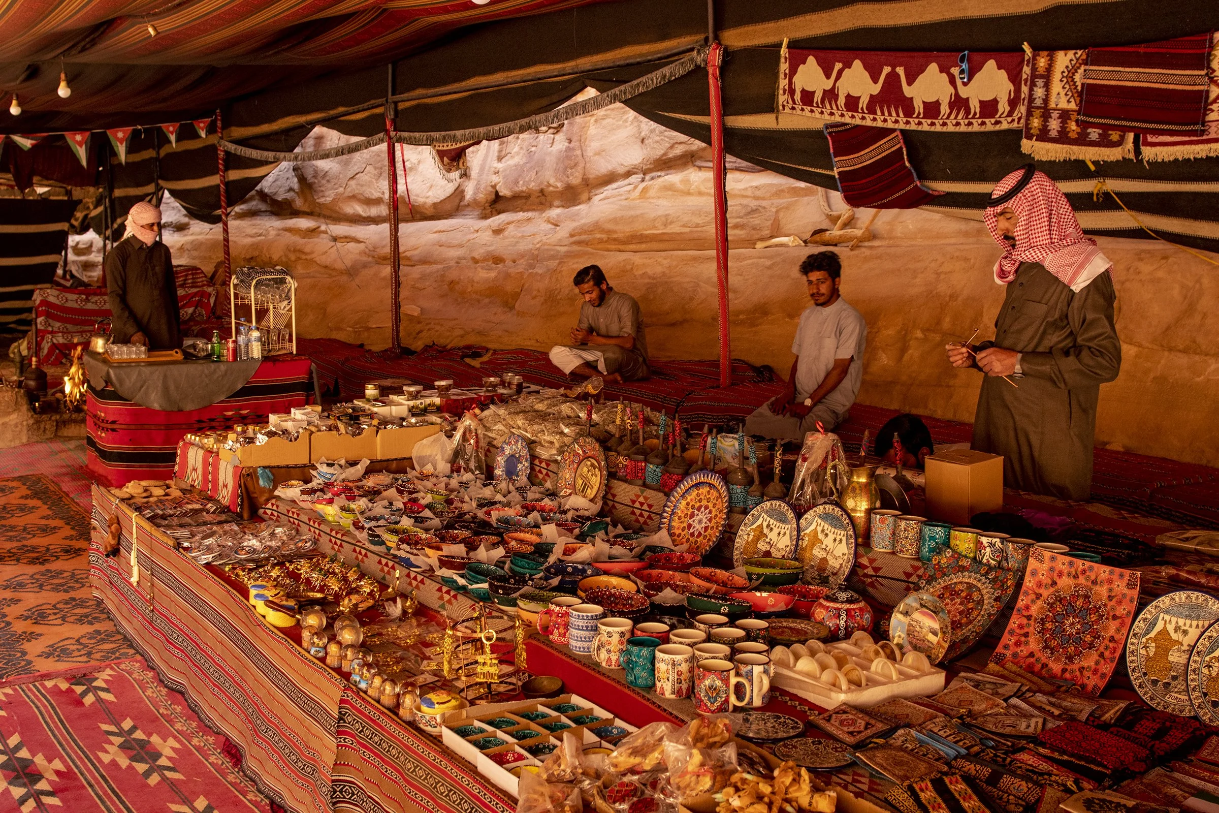  Bedouin tribesmen running a tent and resting site where souvenirs are sold to tourists in Wadi Rum. 