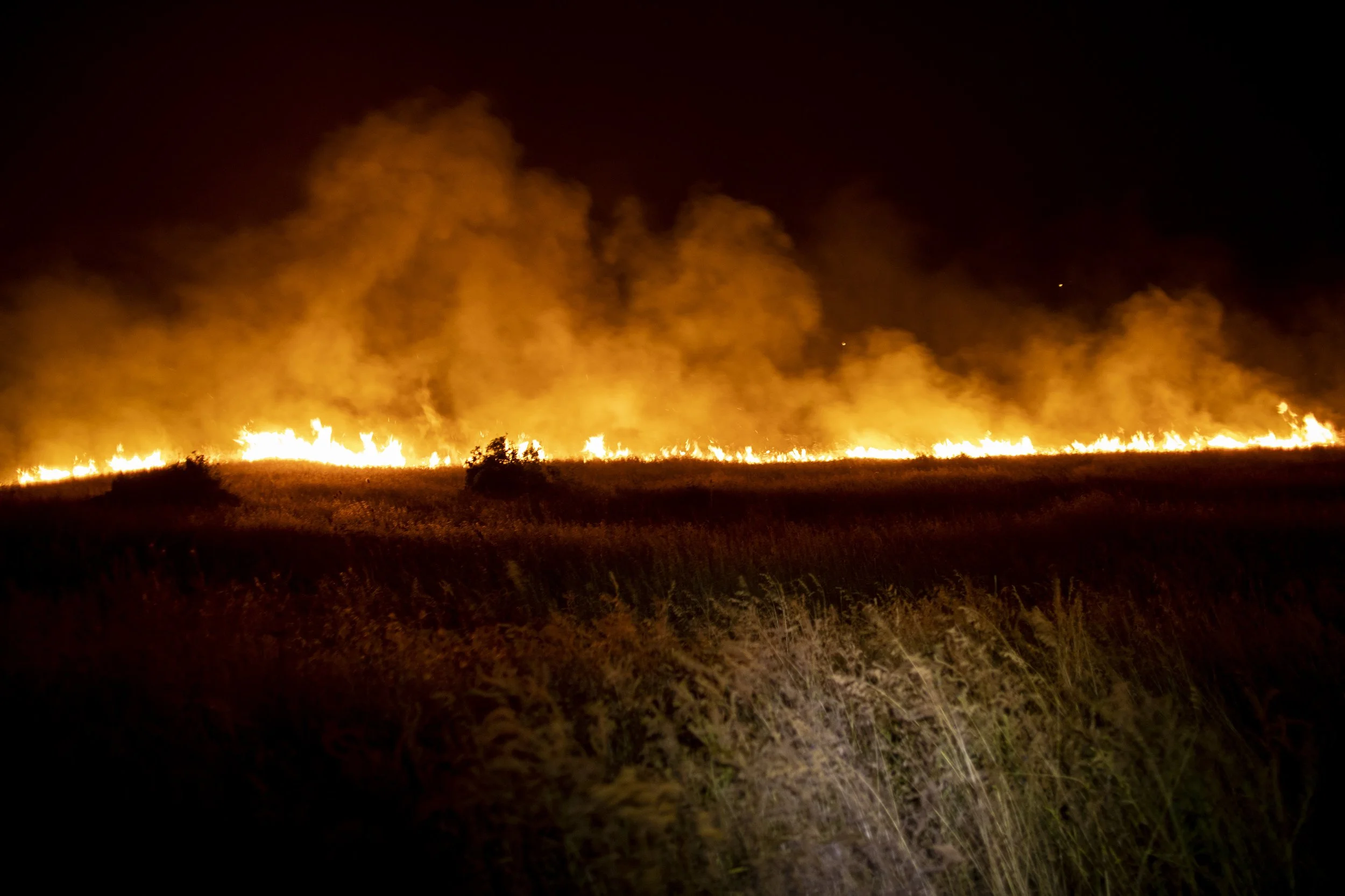  A fire front burning in the night at the Double Creek fire in Oregon. 