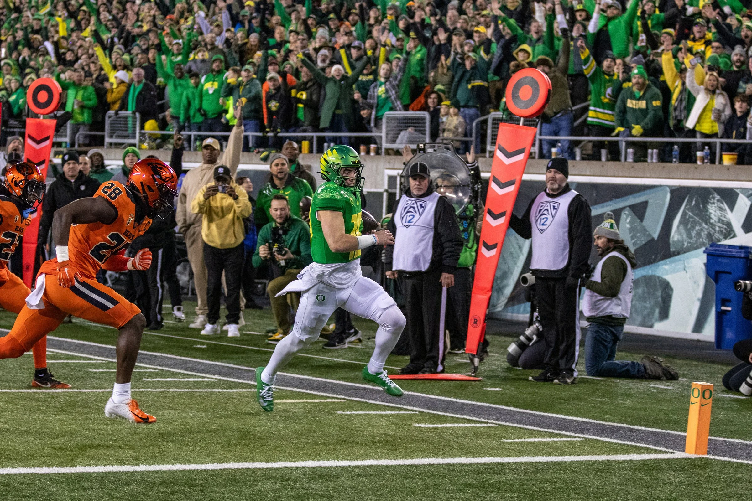  Ducks quarterback Bo Nix (#10) running the ball before scoring a touchdown against the Beavers. The University of Oregon Ducks defeated the Oregon State University Beavers 31-7 in what could be a historic end to the teams’ rivalry as the Ducks leave
