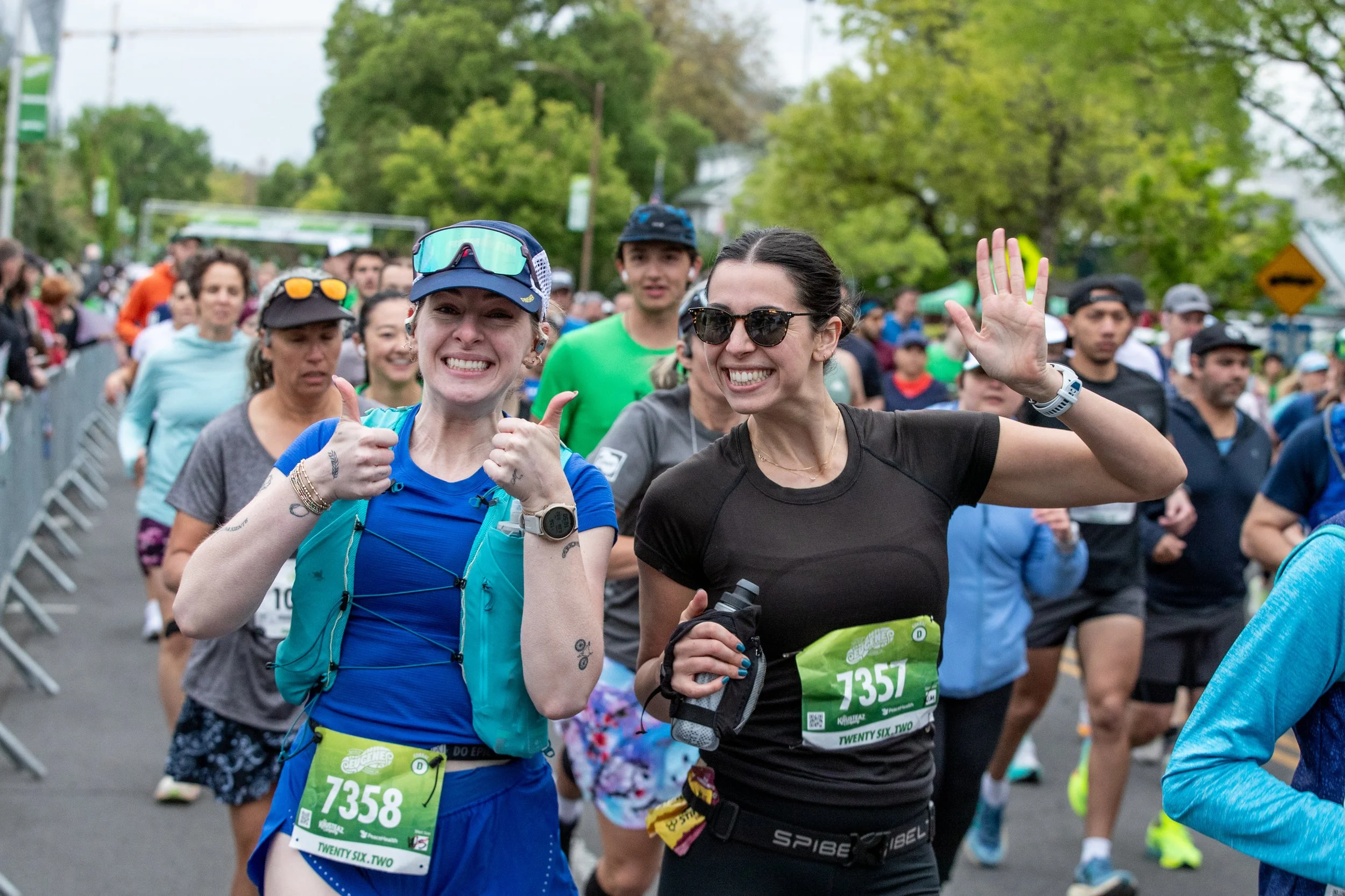  Competitors in the Eugene Marathon wave and smile after starting their race on April 27, 2025. 