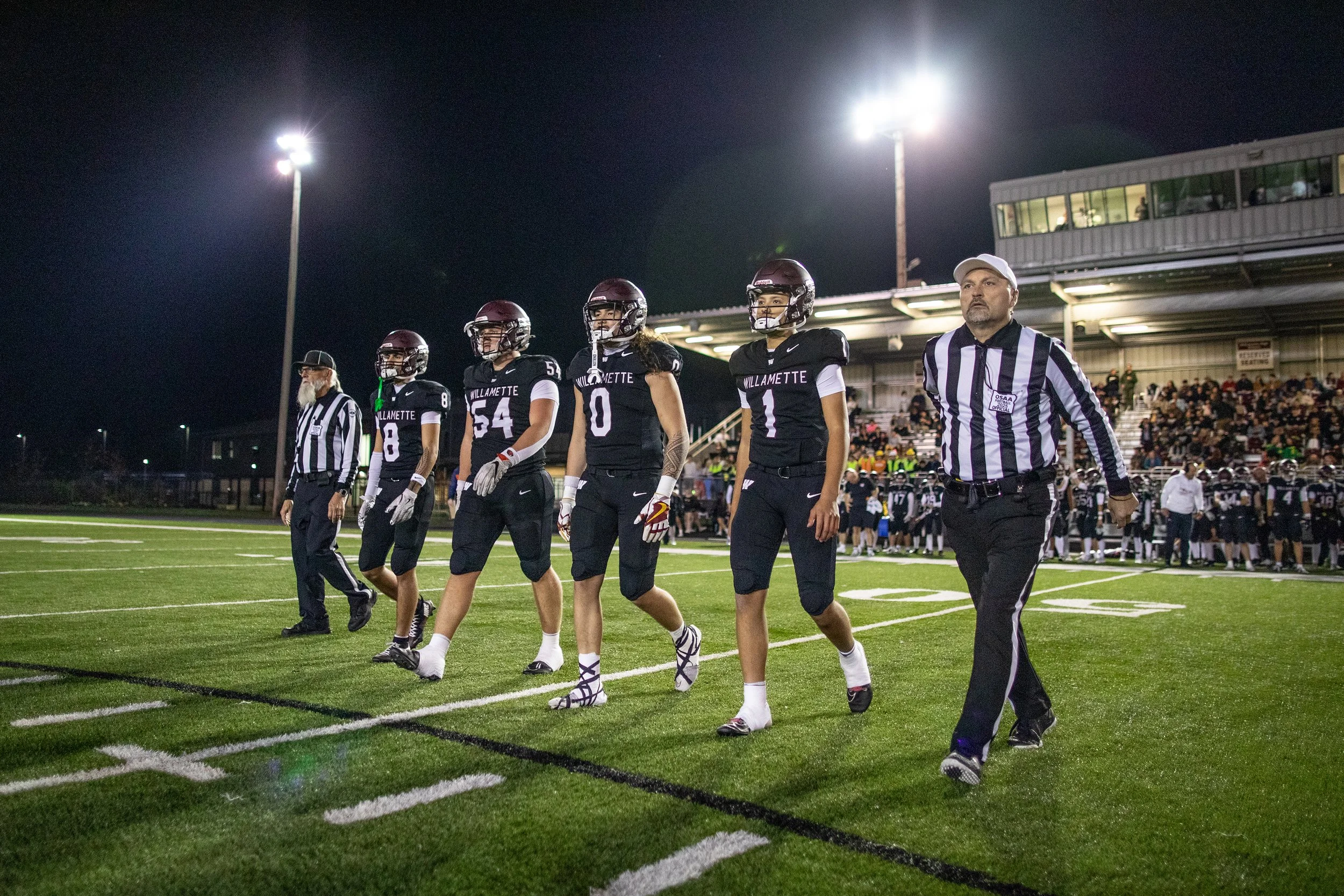  Willamette team captains walk on to the field for the starting coin toss. The Willamette Wolverines fell to the Central Catholic Rams 27-20 in the OSAA 6A championships quarterfinals on Nov. 14, 2025, ending the team's historic season and undefeated