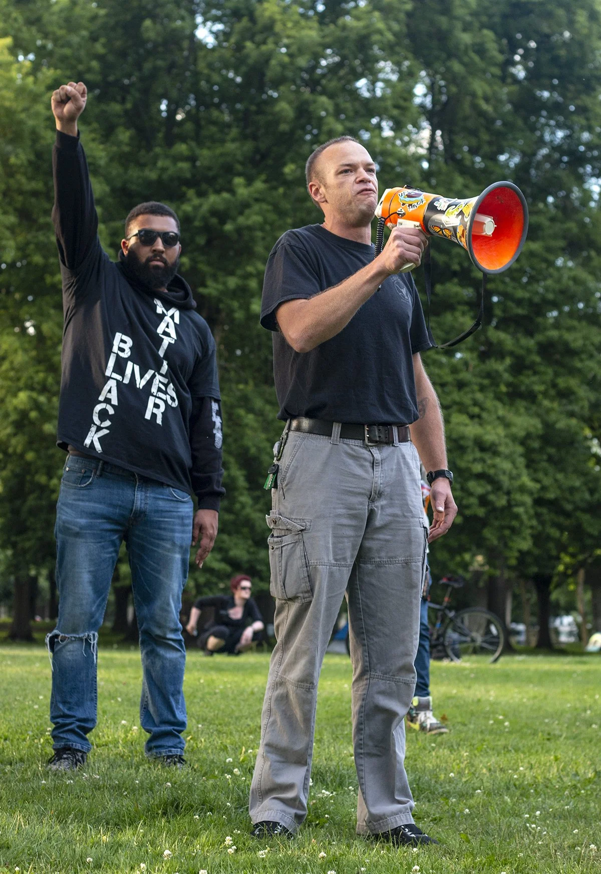  CAHOOTS Medic and Crisis Worker Manning Walker speaks into a megaphone. Hundreds of protesters marched from Monroe Park through the Whiteaker area of Eugene, Oregon, on Thursday, June 11. 