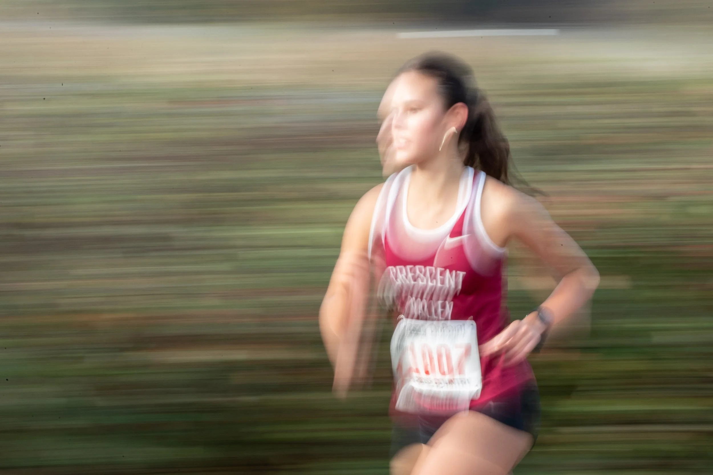  Crescent Valley's Jennifer Sebring runs past spectators during her race in the OSAA State Cross-Country Championships girls 5A 5000m division on Nov. 8, 2025. 