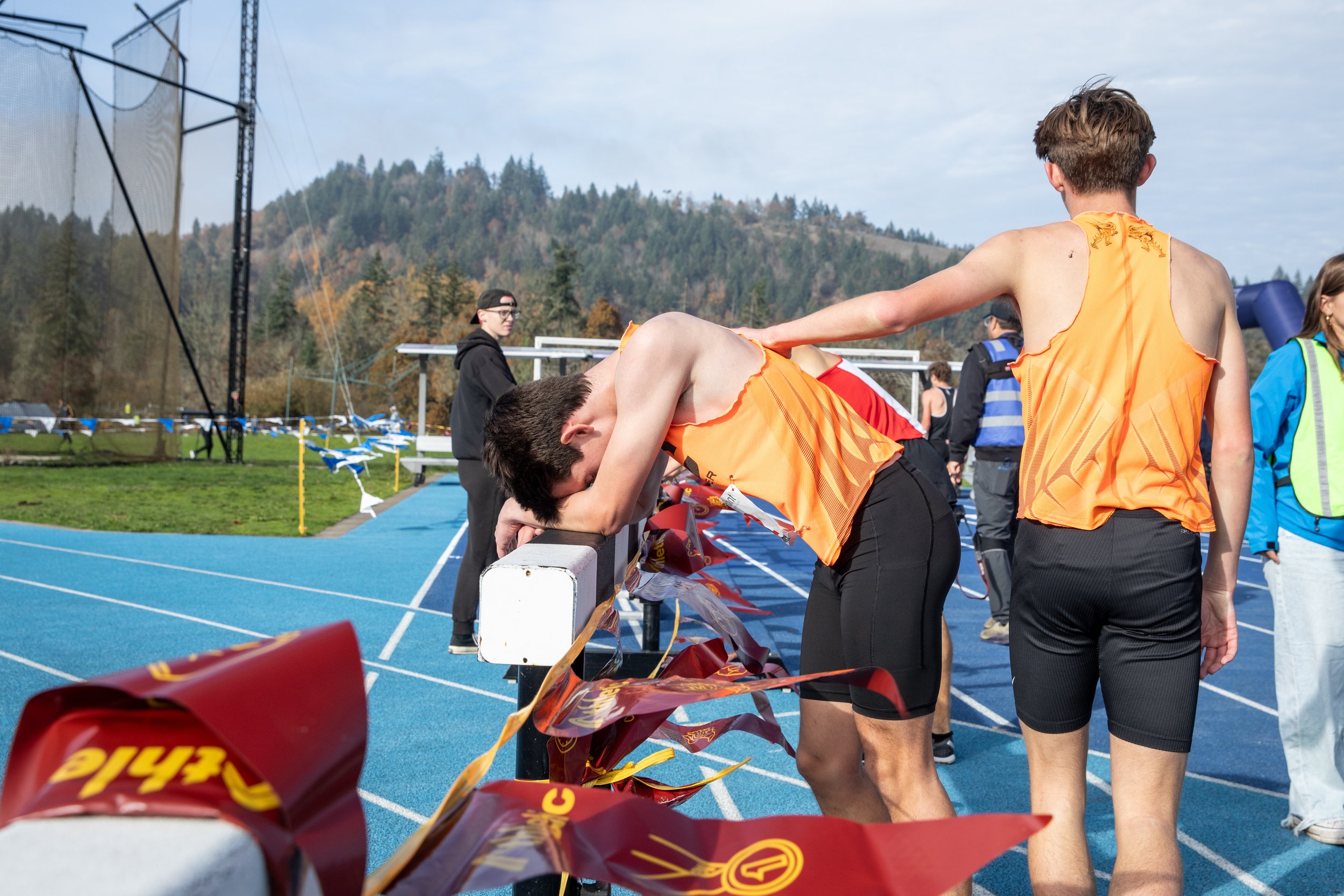  A Crater High School student consoles his teammate after competing in the OSAA State Cross-Country Championships on Nov. 8, 2025. 