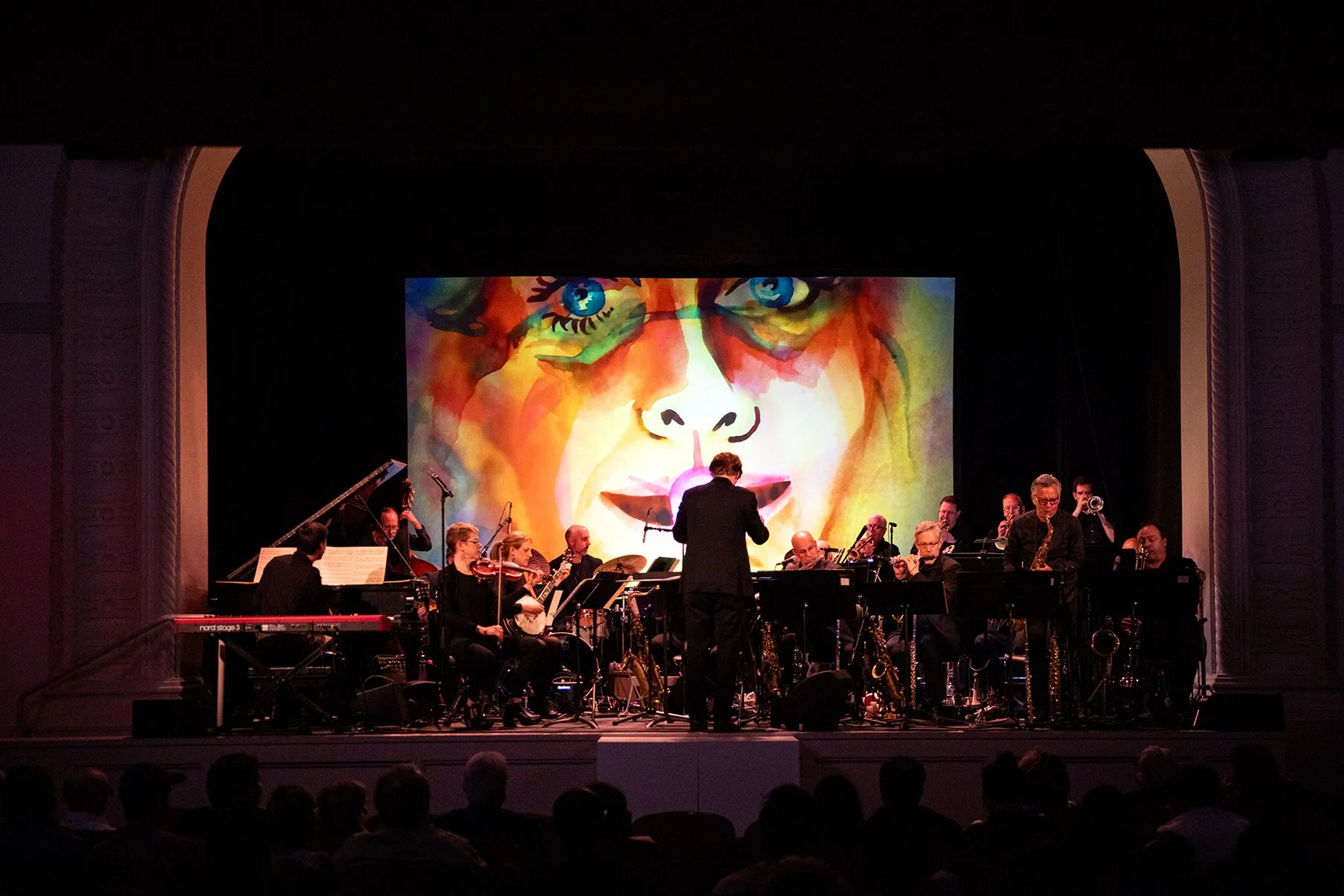 watercolor animation by Anne Beal plays as Zuar's orchestra performs