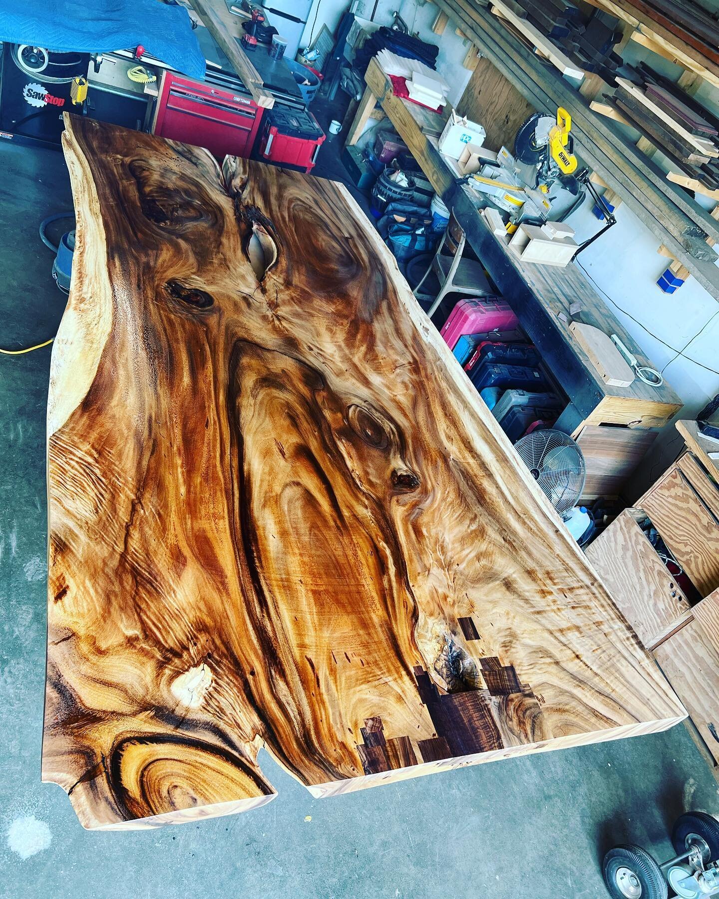 The grain and figure are really starting to pop on this monkey pod slab table. Our clients have had this for about ten years. We brought it to the shop, flattened it, patched a few areas, and now we&rsquo;re laying down the finish. We&rsquo;ve been l