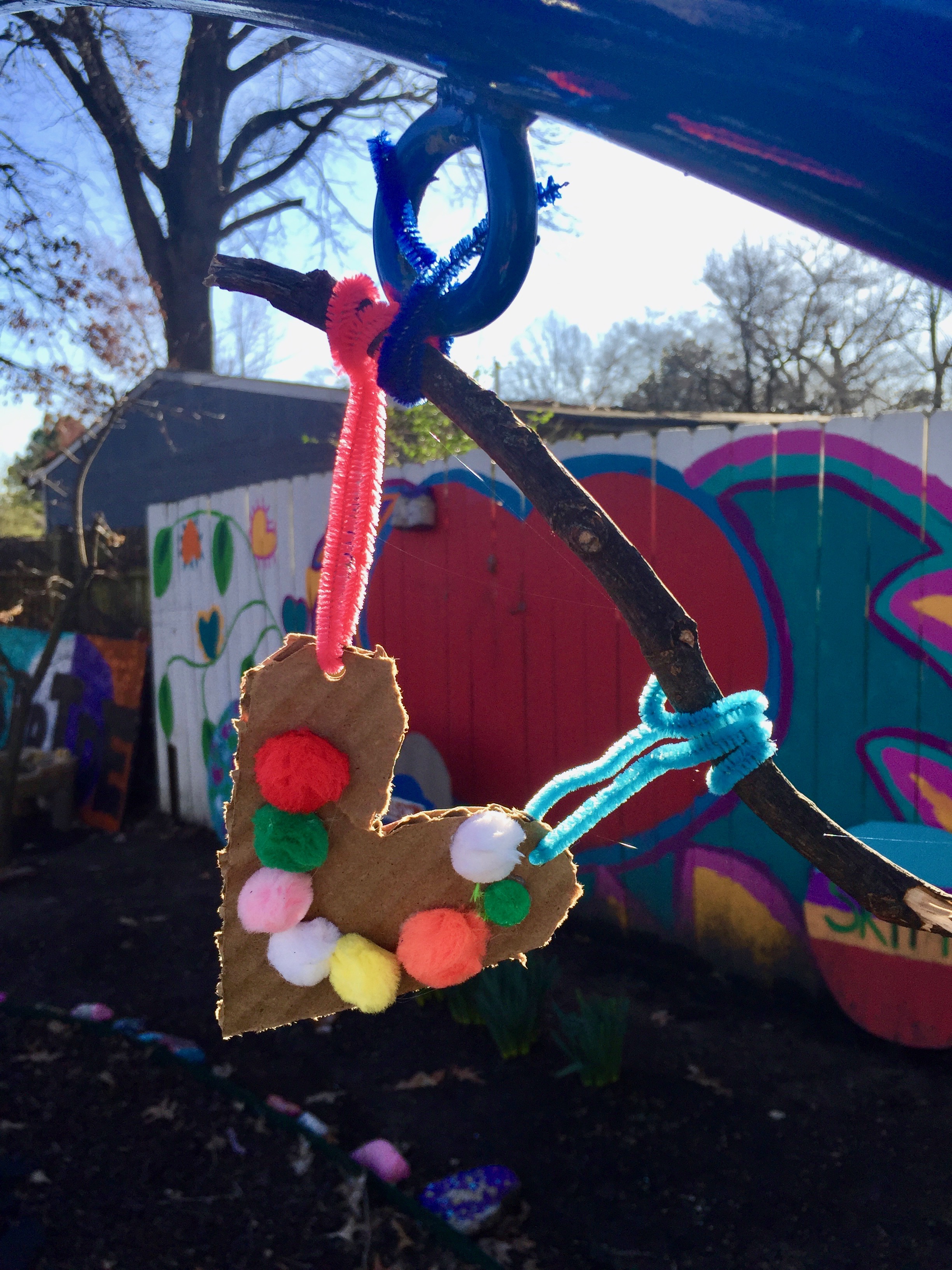 a-cardboard-heart-hanging-up-in-the-art-garden.jpg